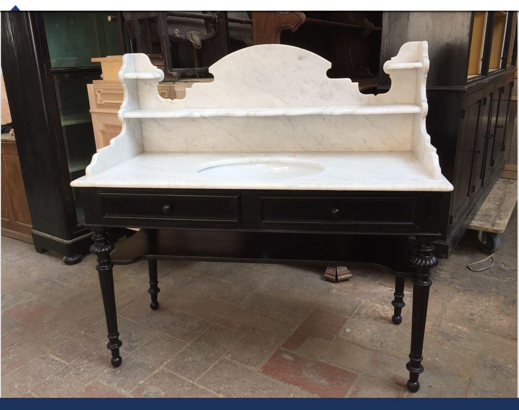 Italian ebonized wood with two drawers and Carrara marble top sink from 20th century
Measures: Width cm 57, length cm 130, height cm 127 (top height cm.82).