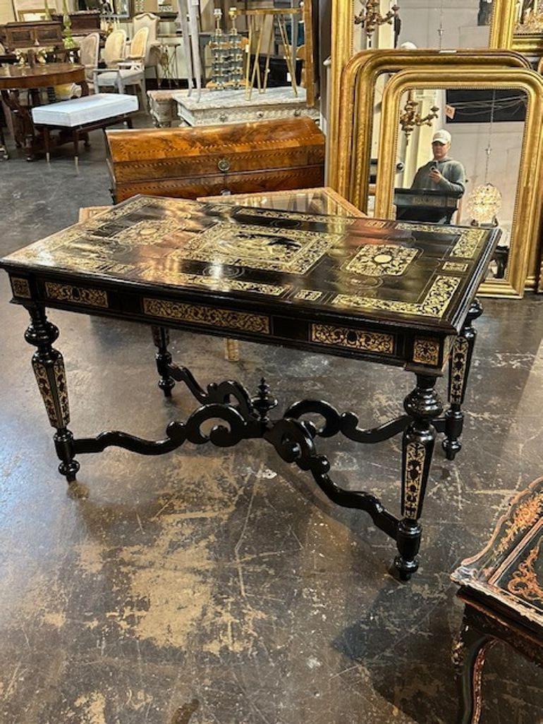 Rare 19th century Italian ebony and ivory inlaid center table. Circa 1860. Sure to make a statement!