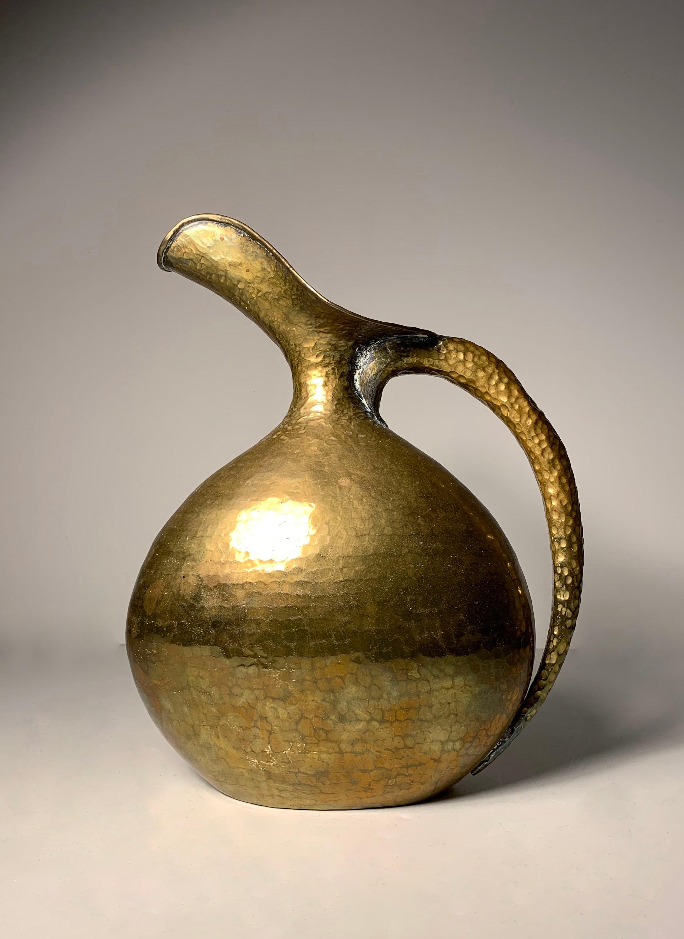 Italian Egidio casagrande hammered brass pitcher

One impact spot on the handle as shown. Otherwise, quite beautiful condition.