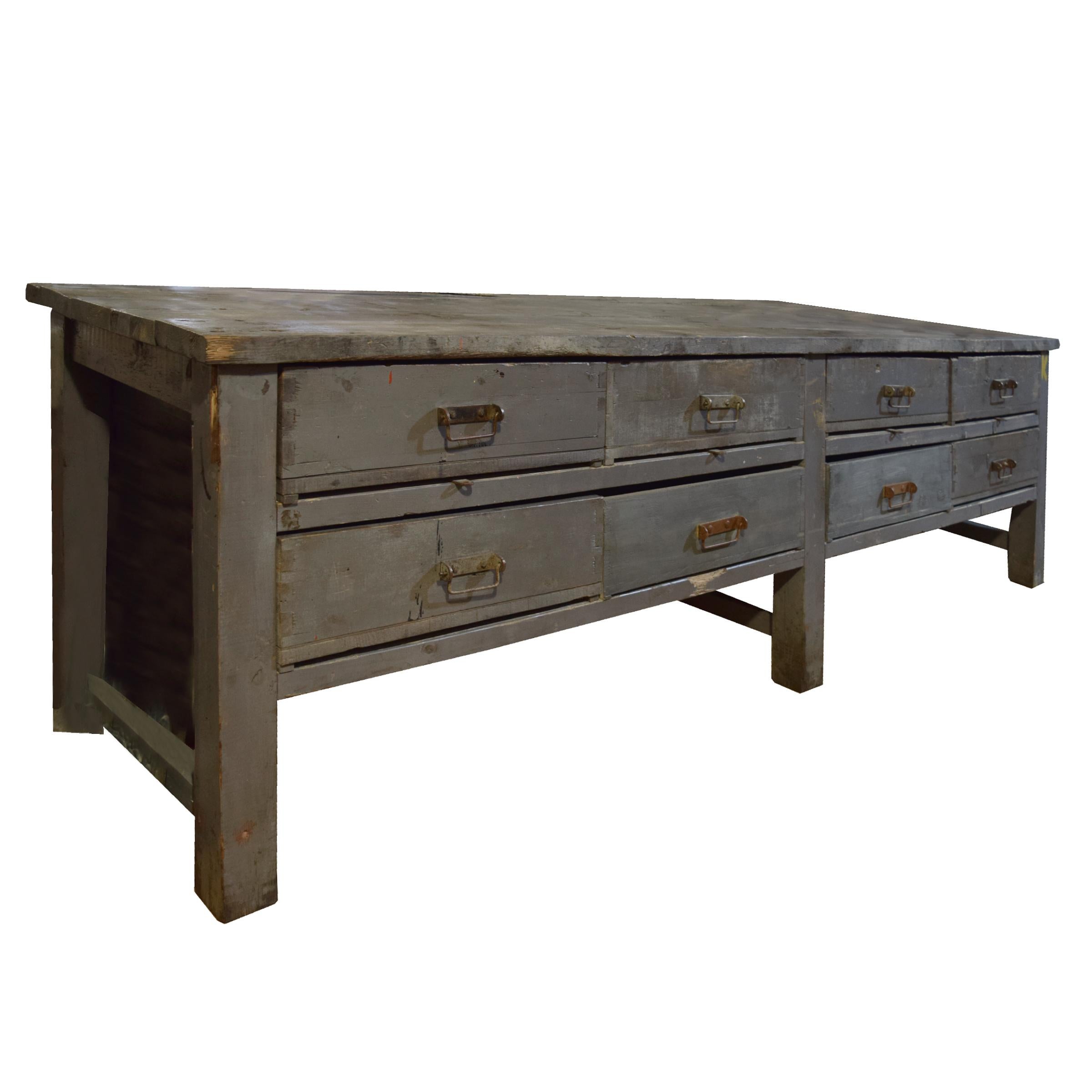 A fantastic Italian eight-drawer wood console with a great patina from the Moto Guzzi factory.