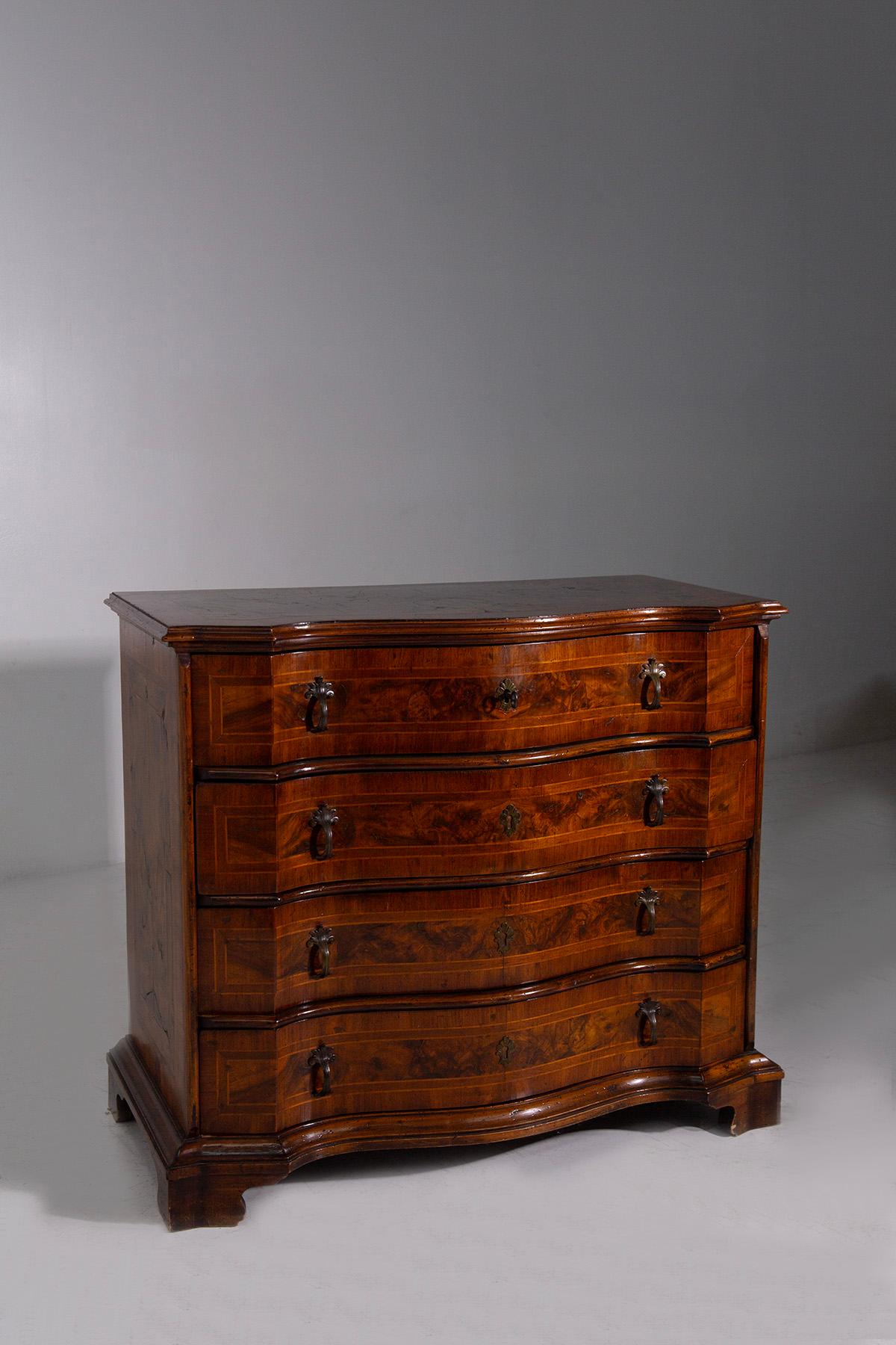 Enhance your living space with our exceptional 18th-century Italian sideboard. This rare antique, attributed to Northern Italy's craftsmanship, exhibits ornate design with a sophisticated burl wood finish. Each of the four drawers is a testament to