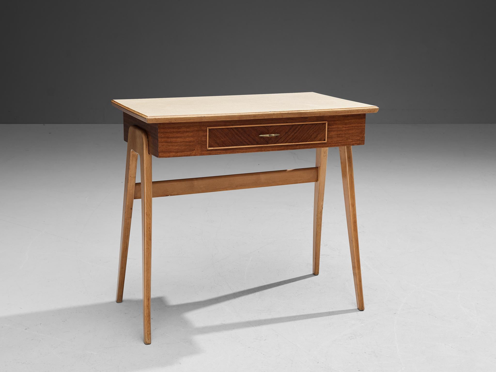 Writing desk, mahogany veneer, walnut, brass, formica, Italy, 1950s

Very elegant desk made in Italy in the 1950s. This desk is executed in a walnut frame. The upper part of the piece is veneered, and the top is inlayed with a very practical