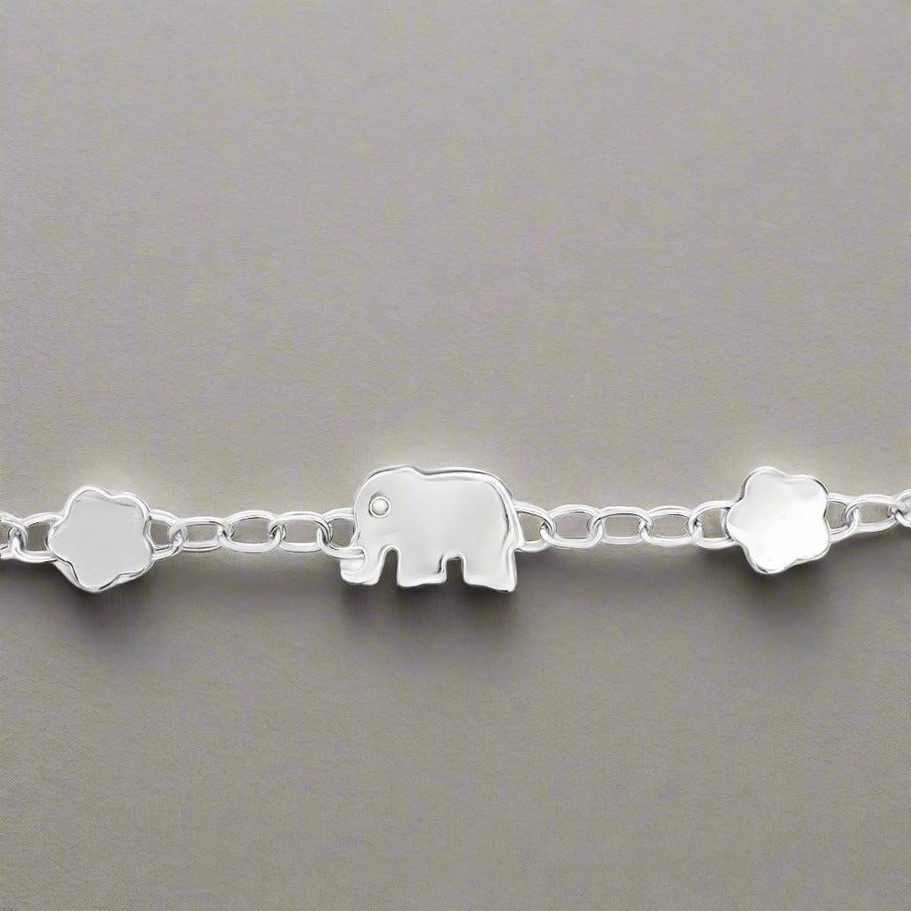 The Italian Elephant and Flower White Gold Bracelet combines symbolic elegance with versatile style. Featuring an elephant motif that represents strength, wisdom, and good luck, alongside delicate floral details, this bracelet is perfect for
