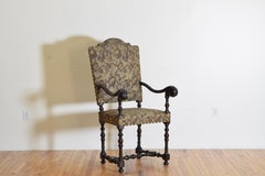 Italiano, Emiliana, Poltrona aperta barocca in legno di noce intagliato e sagomato, 1680 ca.