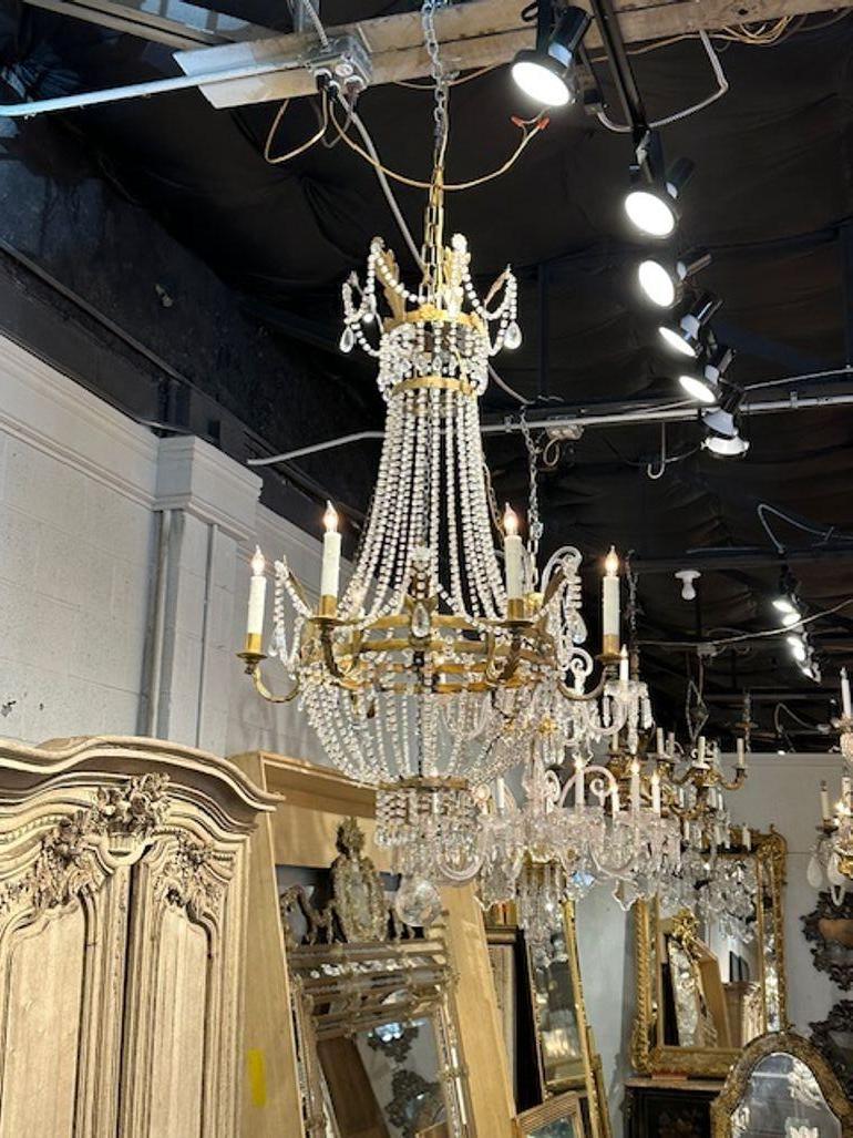 19th century Italian Empire style gilt tole and crystal basket form chandelier. Circa 1880. The chandelier has been professionally rewired, comes with matching chain and canopy. It is ready to hang!