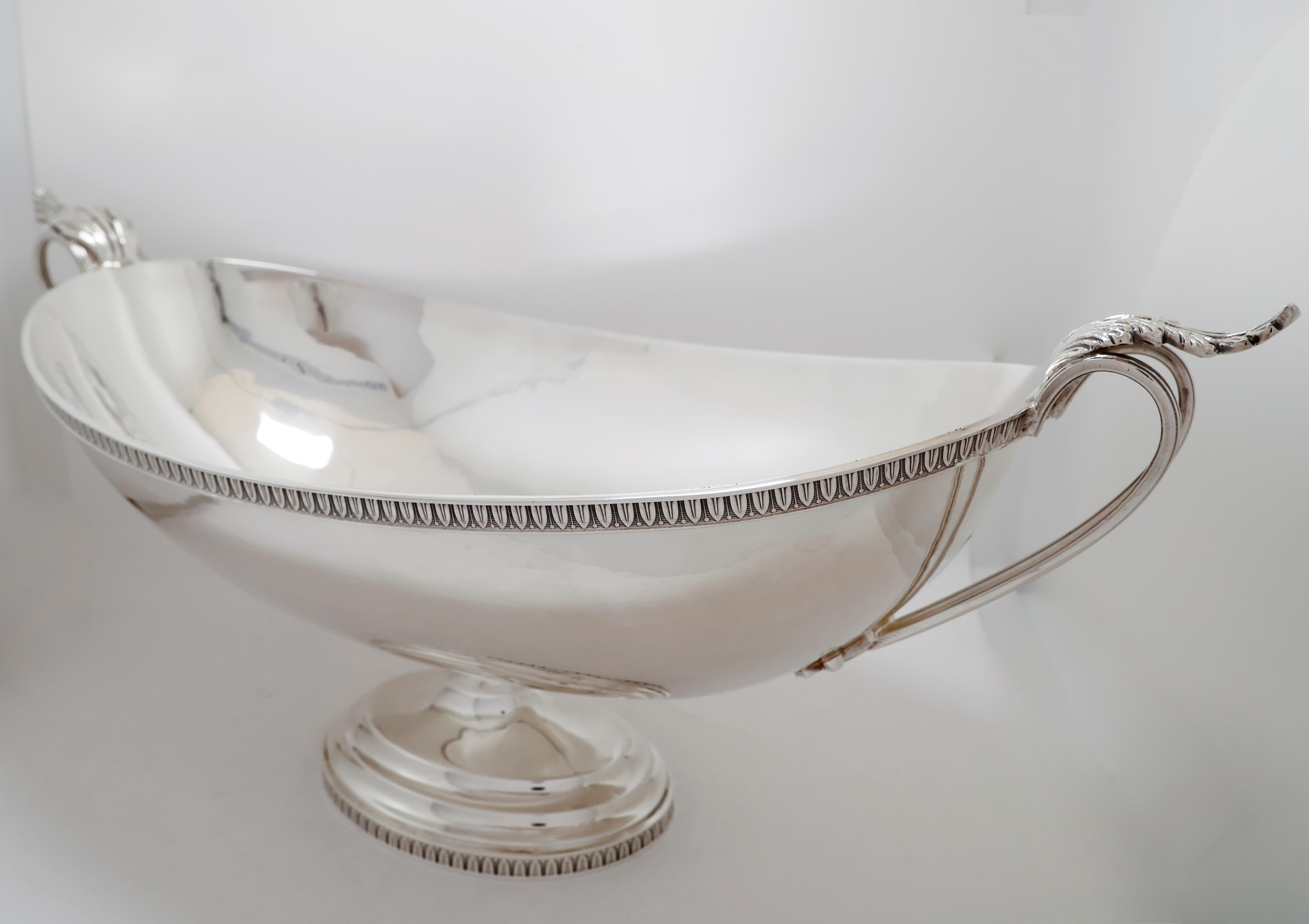 Refined jatte centerpiece crafted in Italian 800 silver, dated 1950, featuring elegant empire-style design elements. The wide, polished bowl is adorned with a detailed ornamental border and two gracefully curved handles with leaf-motif terminals.