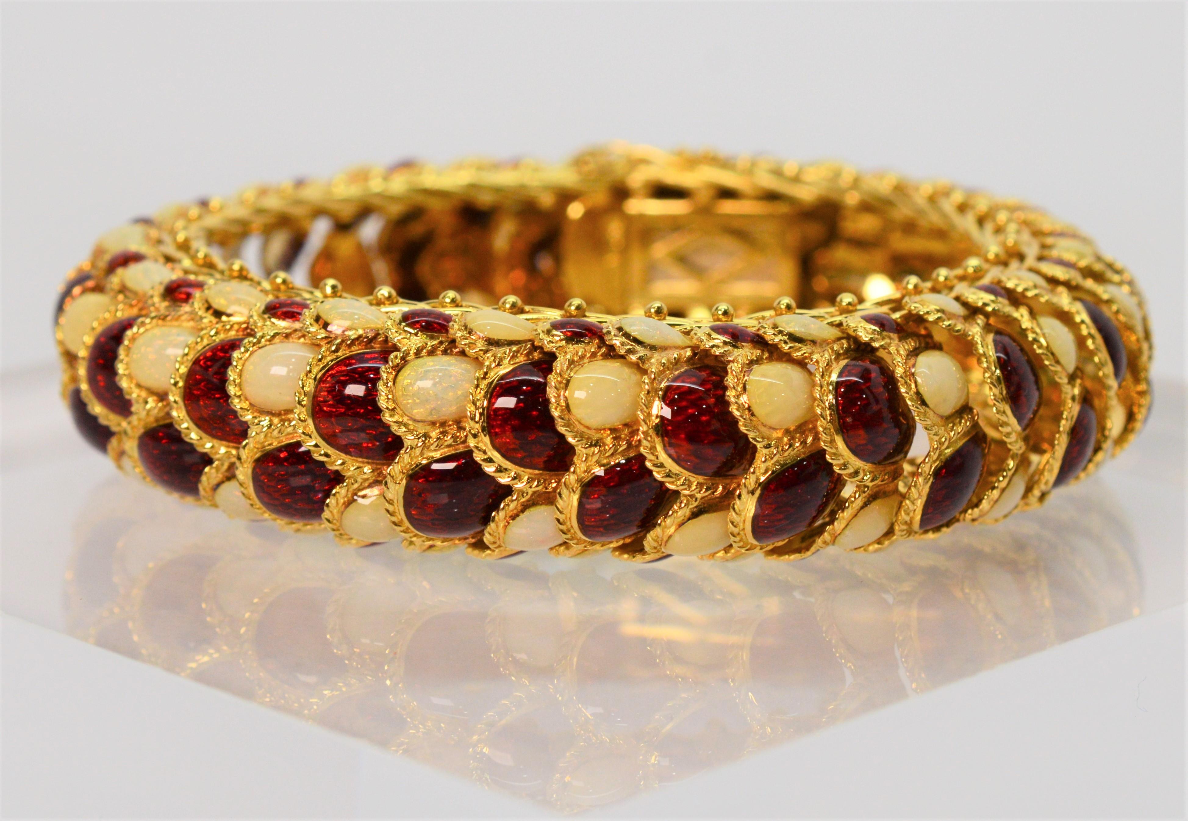 Superb statement piece exhibiting masterful Italian craftmanship. Truly eye catching with stunning garnet and opal colored hand painted glass enamel links that are individually framed, each with a twist of bright yellow gold to form the reptilian