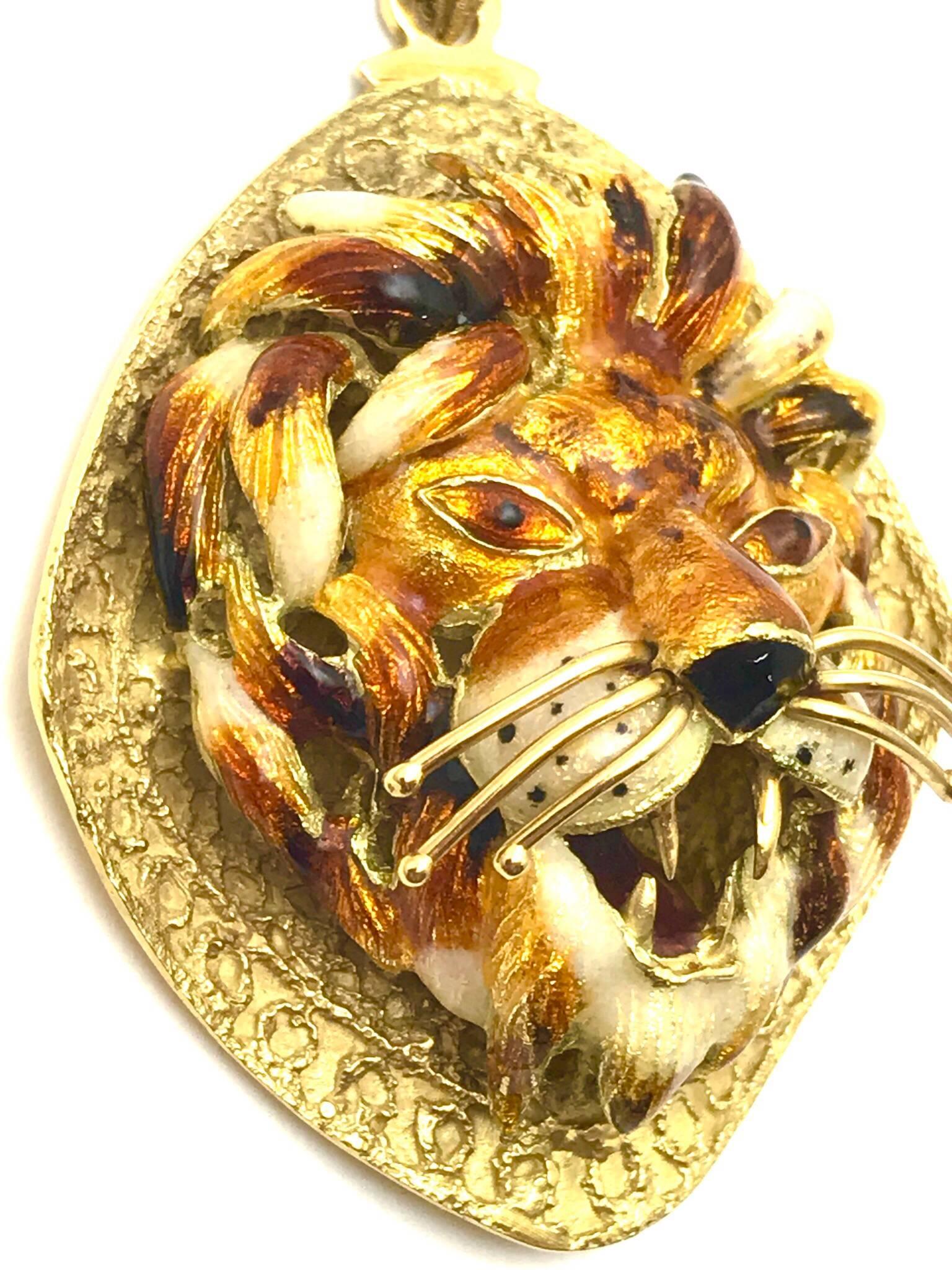 18kt yellow gold enamel lion has been designed with varying shades of reds, orange, yellow and white enamel. Italian in origin, the fine workmanship is indicative of a specialized talent and craftsmanship. The lions eyes has been are black and