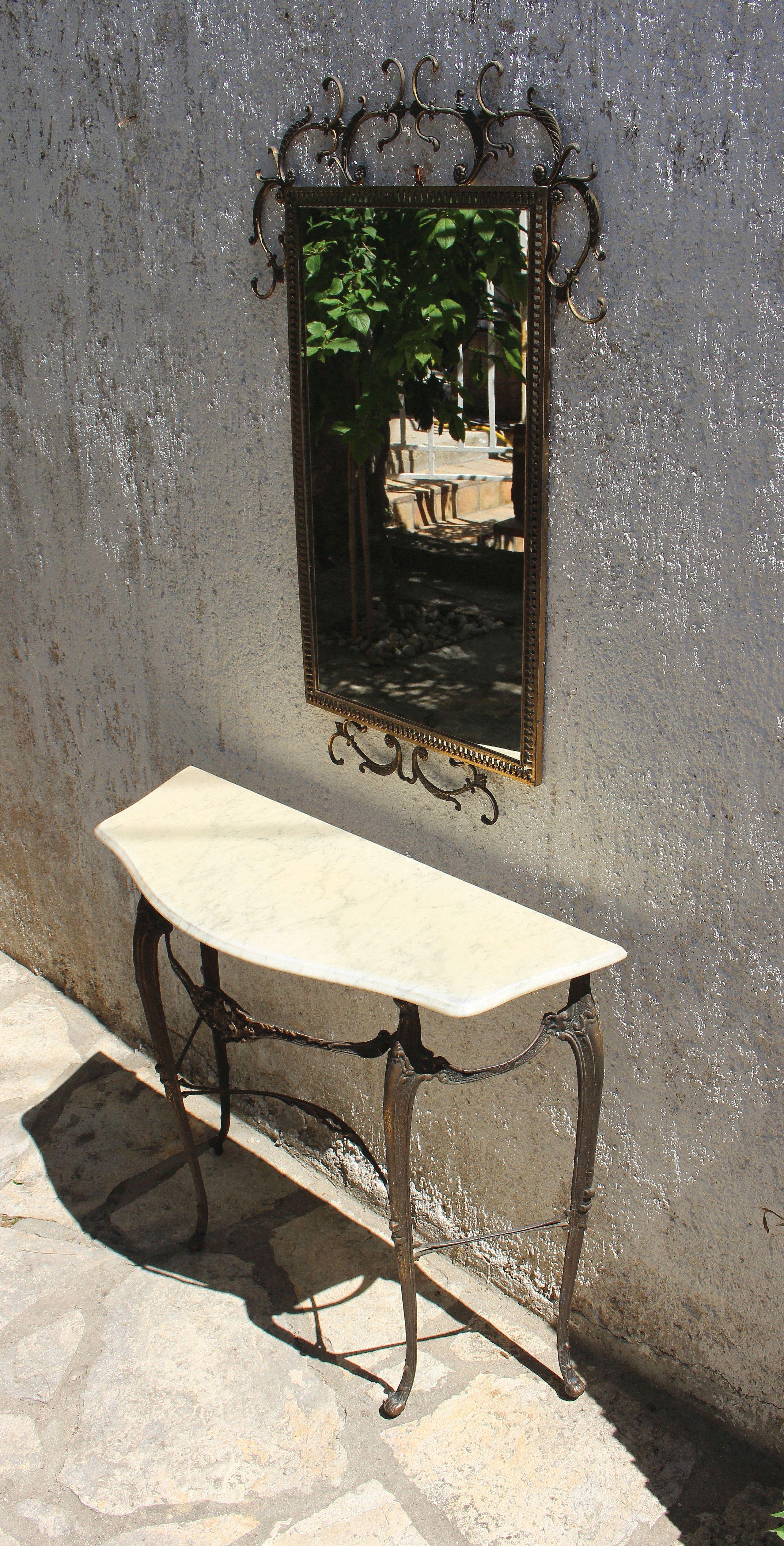 Neoclassical style brass base and marble top entry console table. Matching brass mirror.
Dimension for he mirror is : H; 35.5 W; 23 D; 6
dimension for the demi Lune table is : H ; 29 W: 33; D; 12.
Shipping to US continental in home delivery $400


