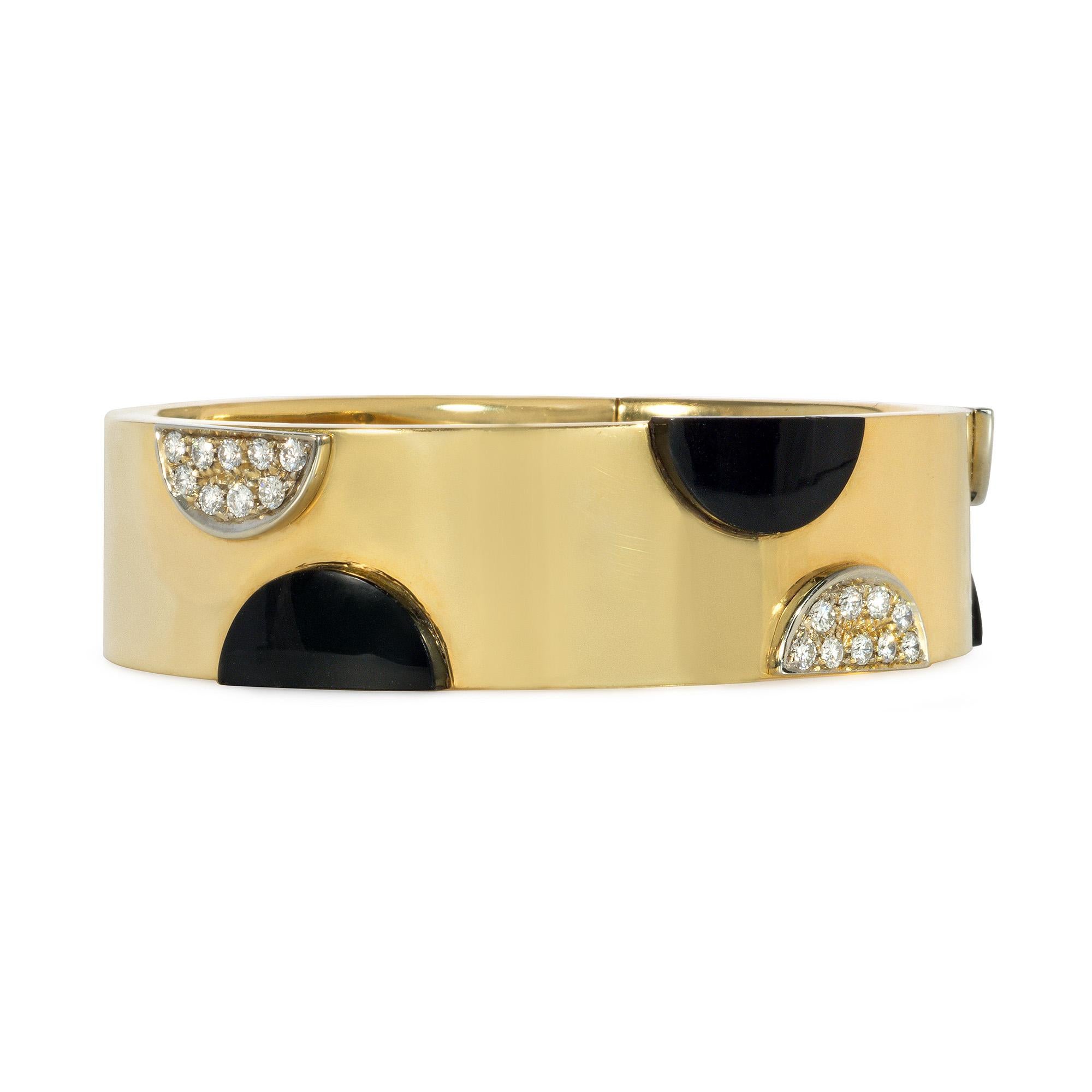 A hinged gold cuff bracelet decorated with applied half-moon onyx and pavé diamond plaques, in 18k.  Italy.  Atw 0.90 ct.  Inner circumference approximately 7.5 inches