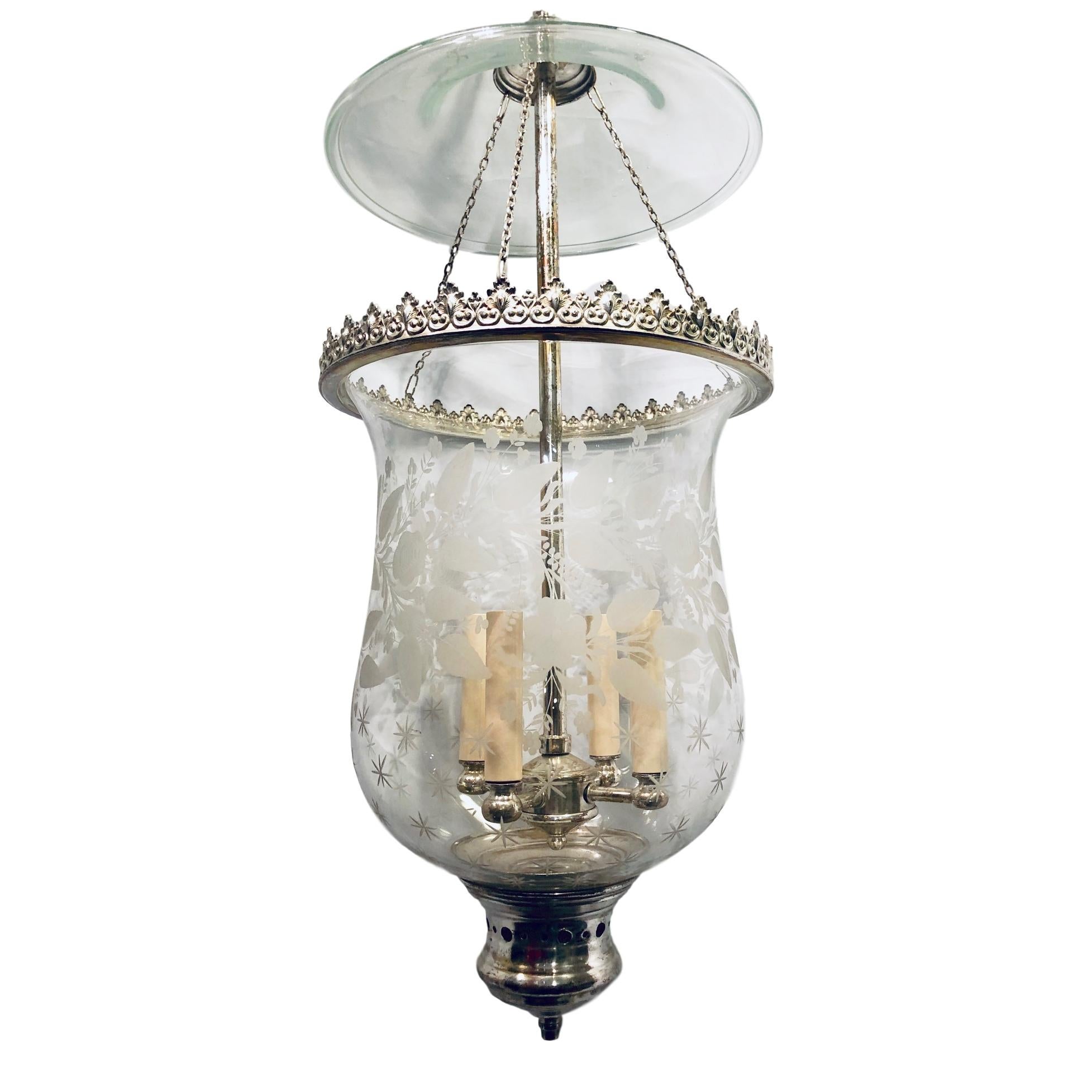 A circa 1910 Italian silver plated lantern with etched glass in floral motif and interior cluster of 4 candelabra lights.

Measurements:
Drop (current) 37