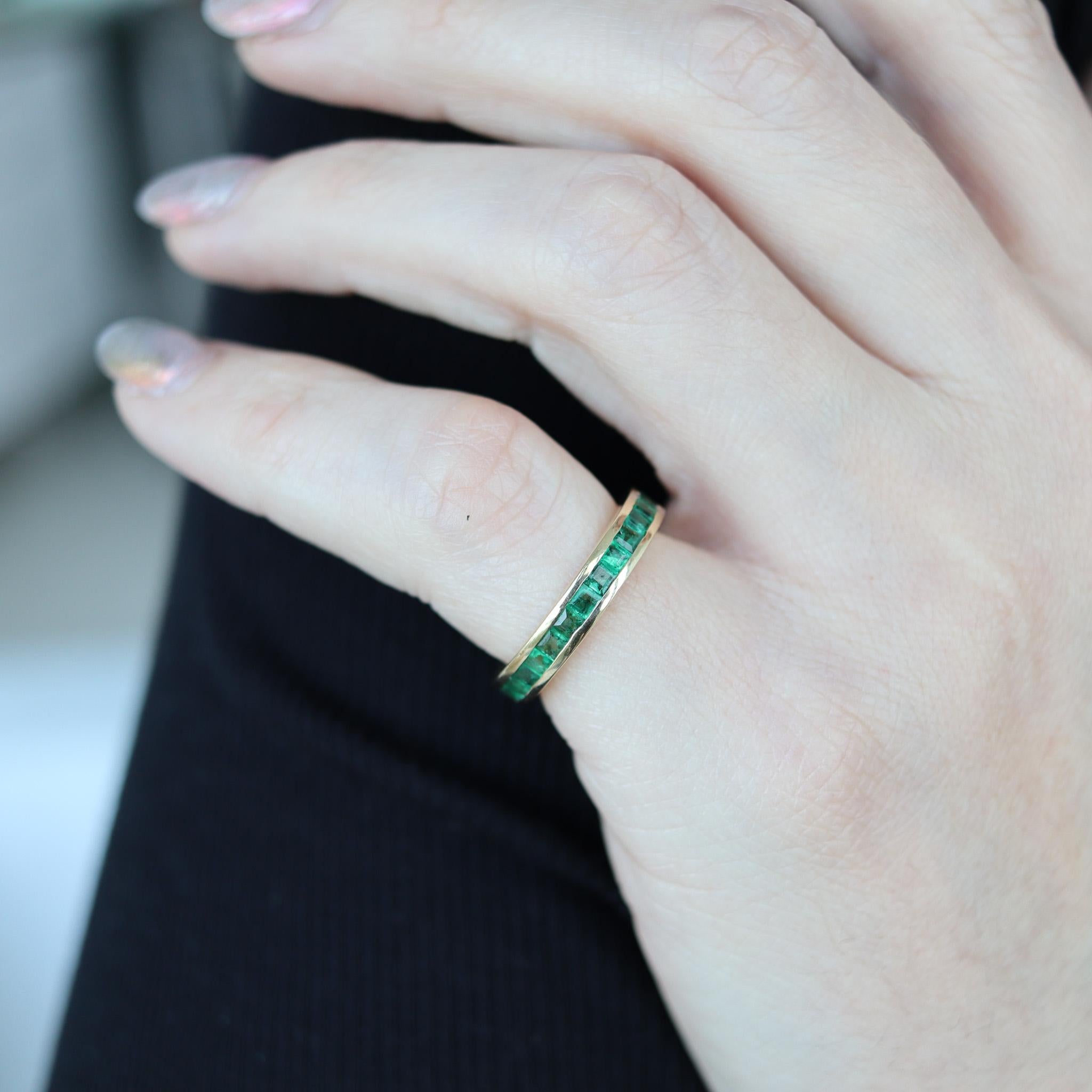 Eternity band with emeralds.

Beautiful eternity band ring, crafted in Vicenza Italy in solid yellow gold of 14 karats with high polished finish. Mounted with a great selection of twenty-nine natural green emeralds.

Emeralds: Mounted in a channel