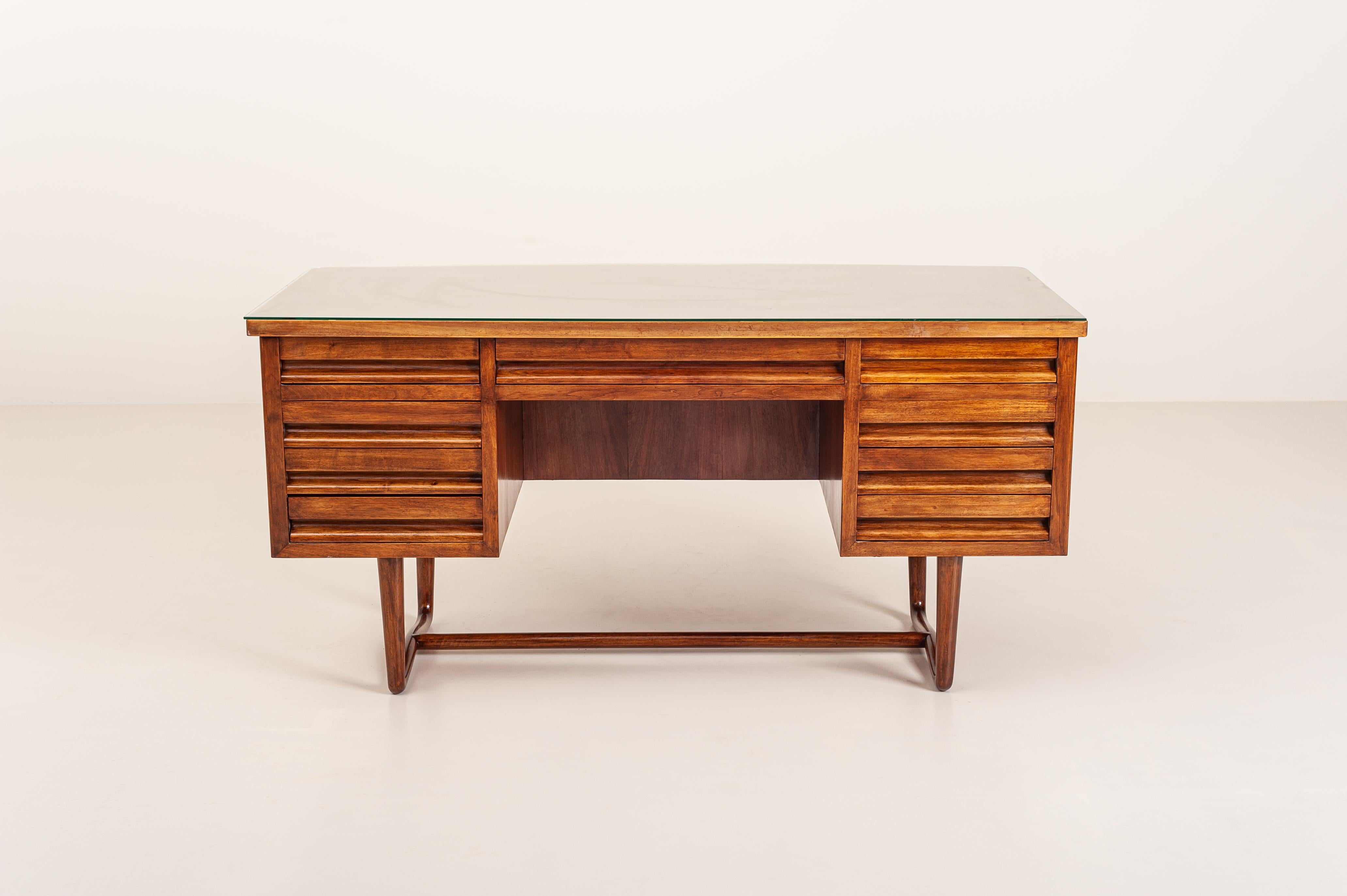 Mid-20th Century Italian Executive Grissinato Desk Made in Walnut with Carved Legs and Glass Top