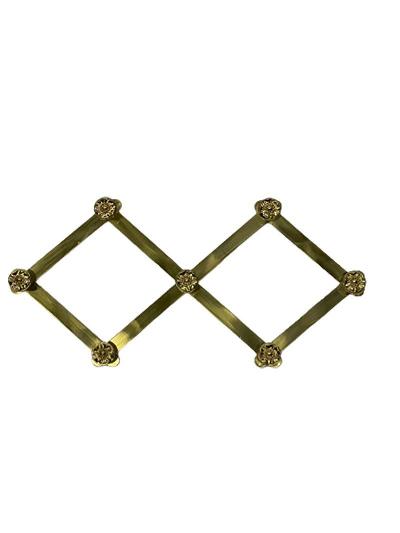 Italian extendable brass coat rack with floral knobs

Attributed to Luigi Caccia Dominioni for Azucena, Italy, 1960s
This brass coat rack is an extendable rack with floral knobs.
The knobs are threaded. The rack can be moved to the desired