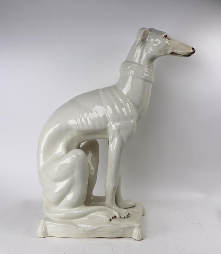 Decorative Italian ceramic faience seated dog figure. Done in off white, free of damage, chips, cracks or repairs. Charming, chic and sophisticated, clean and ready to use condition.