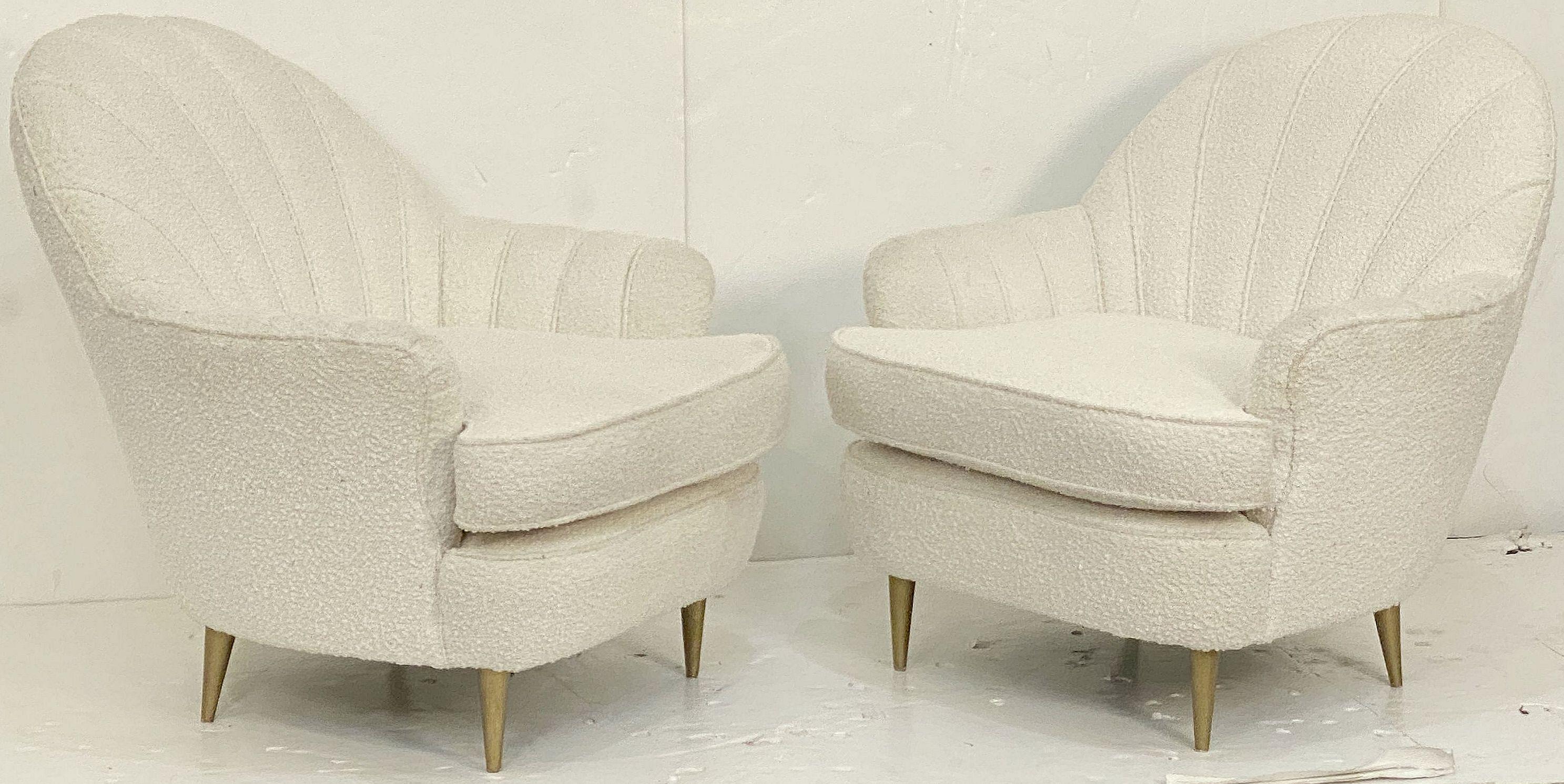 A pair of comfortable Italian lounge chairs with elegant Art Deco fan back accents - each chair featuring re-upholstered back and seat in boucle fabric, on tapering legs. 

Seat H 18 1/4 inches

Two available - Priced individually - $6895 each chair