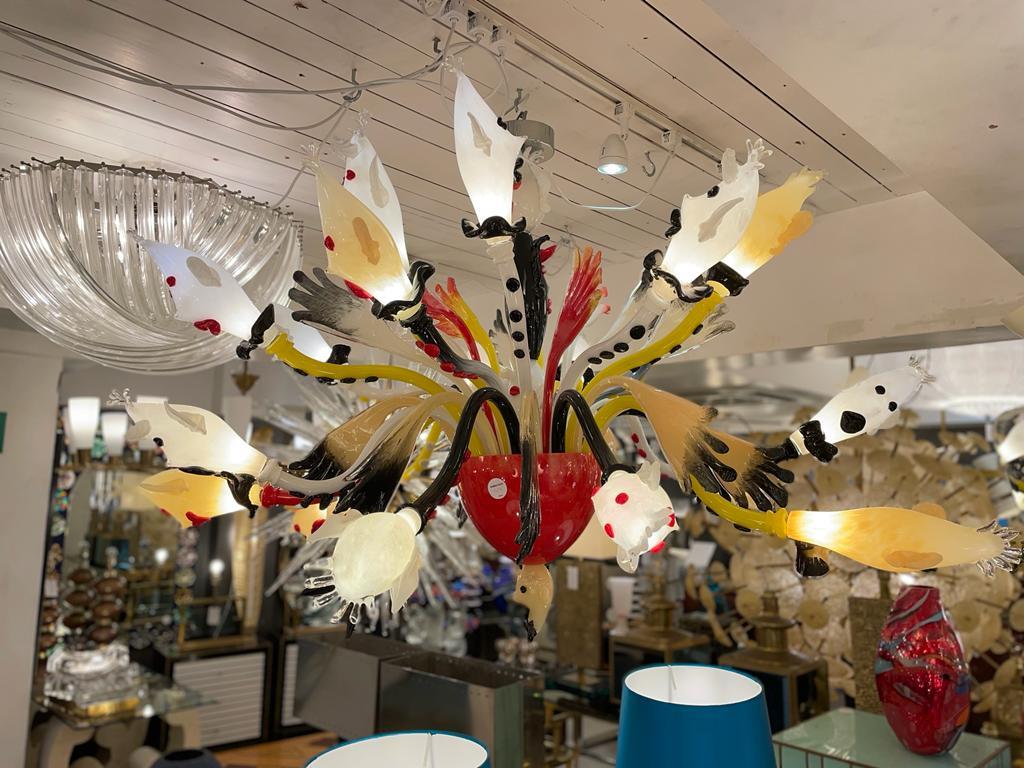A stunning Italian Chandelier in hand blown Murano Glass hand, decorated with original clown/ghost faces brightly coloured. Circa 1980s.