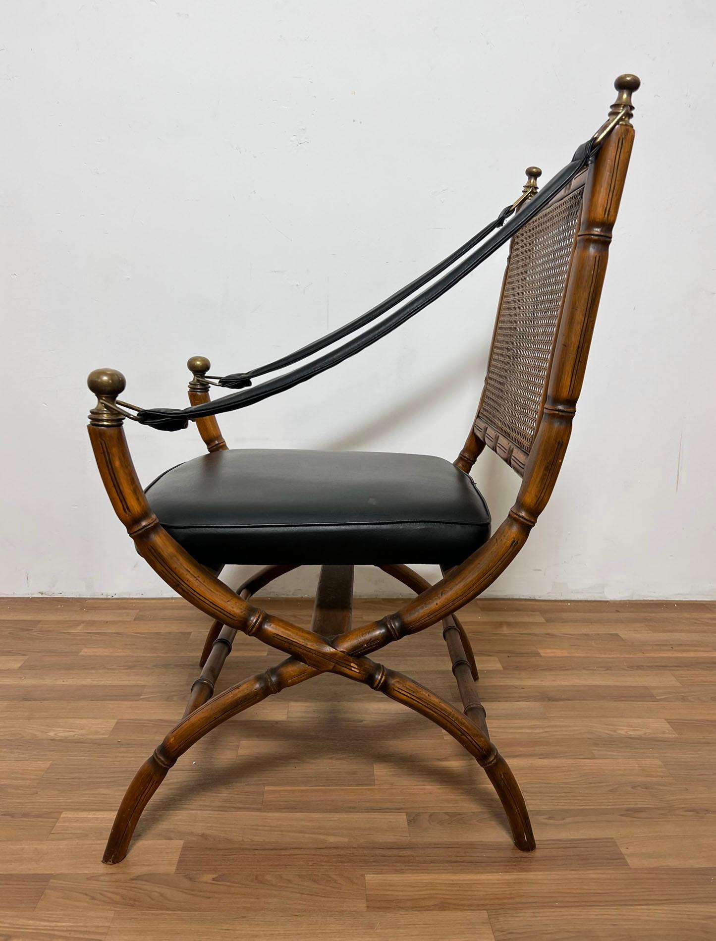 A faux bamboo campaign style arm chair with cane back, made in Italy, ca. 1960s.