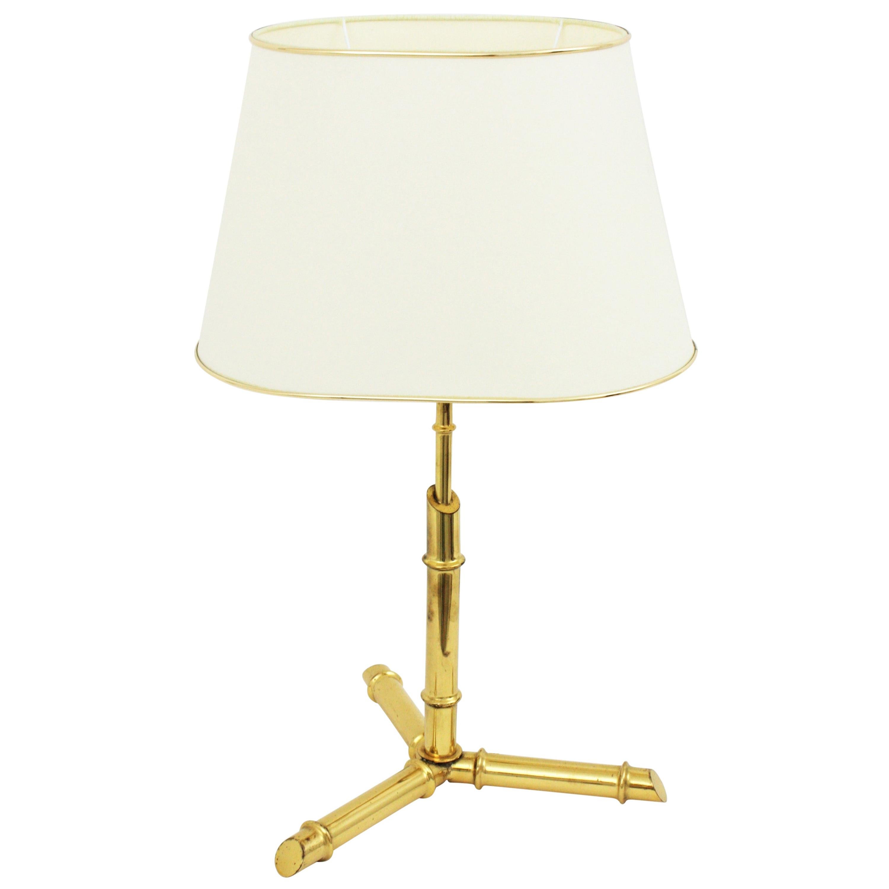 Brass faux bamboo table lamp with cream color shade, Italy, 1950s.
Lampshade is included.
Measures: 42 cm H x 30 cm W x 28 cm D
Overall measures with lampshade: 58 cm H x 36 cm W x 27 cm D.