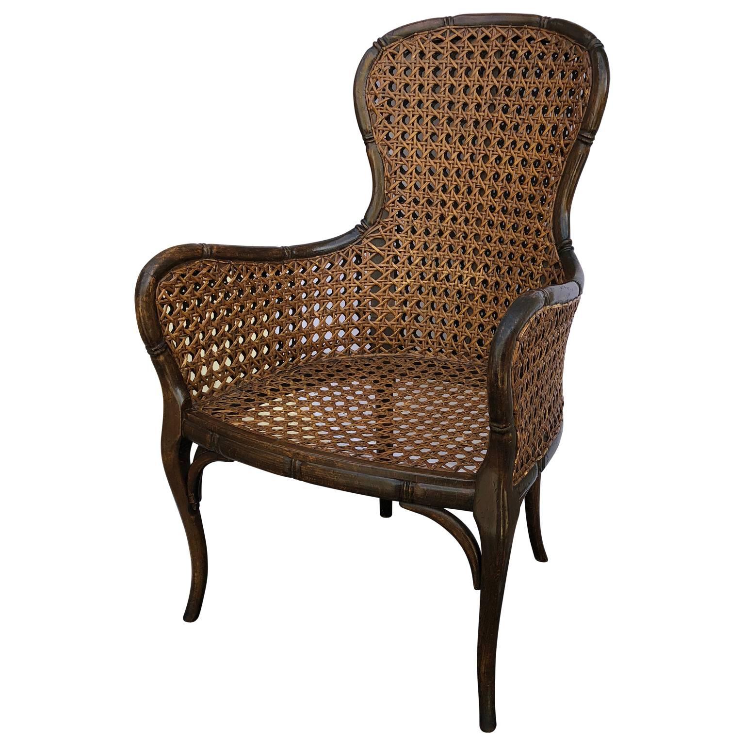 Faux bamboo cabriole leg cane highback armchair, Italy, 1960s.
Chair includes a black vinyl pillow
Measures: Seat height 16 inches
Table height 26 inches
Seat height with pillow 18.5.

 