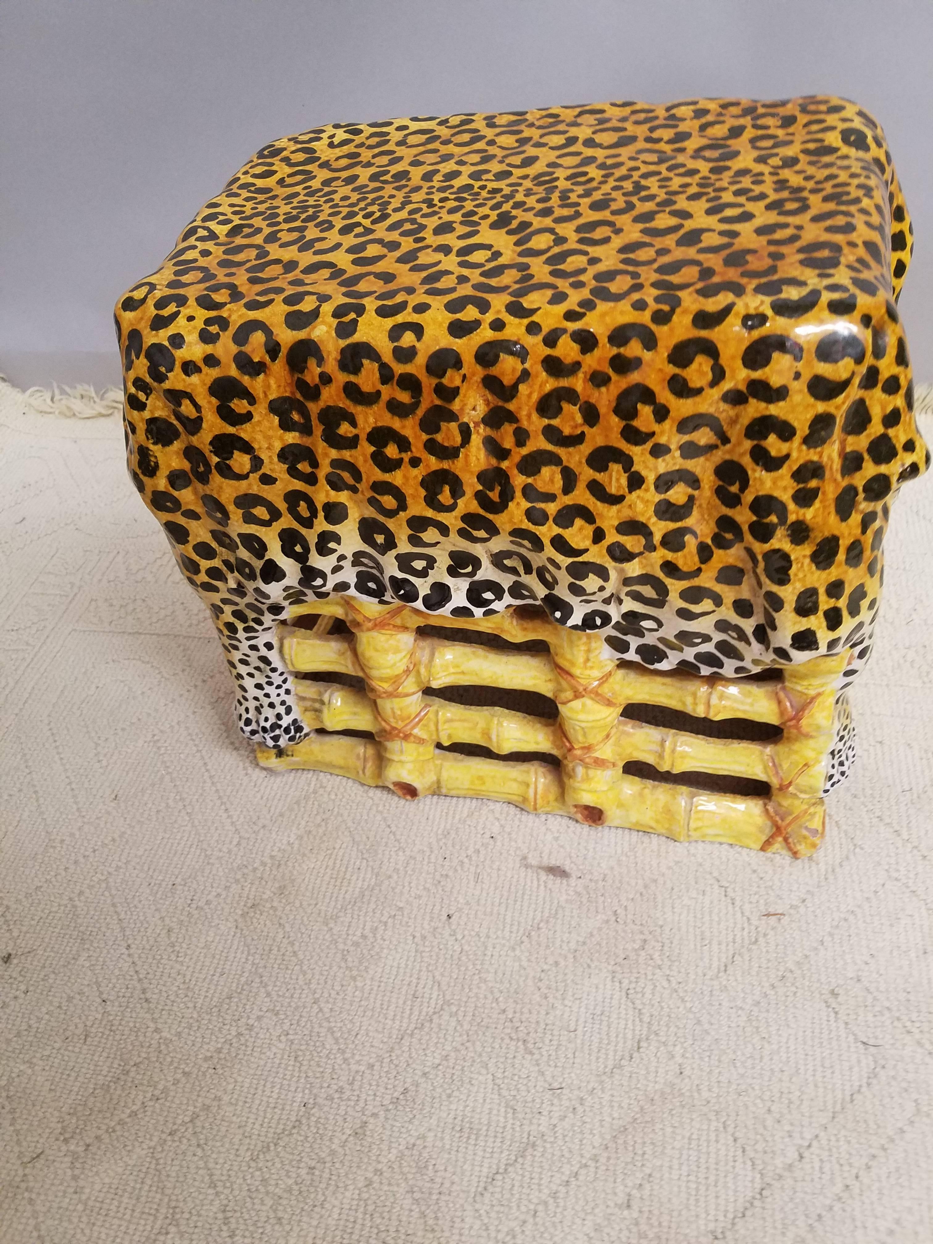 This Hollywood regency leopard and bamboo motif garden seat would be a perfect martini or book table. The whimsical style of a leopard pelt draped over a faux bamboo frame is high style and unique.