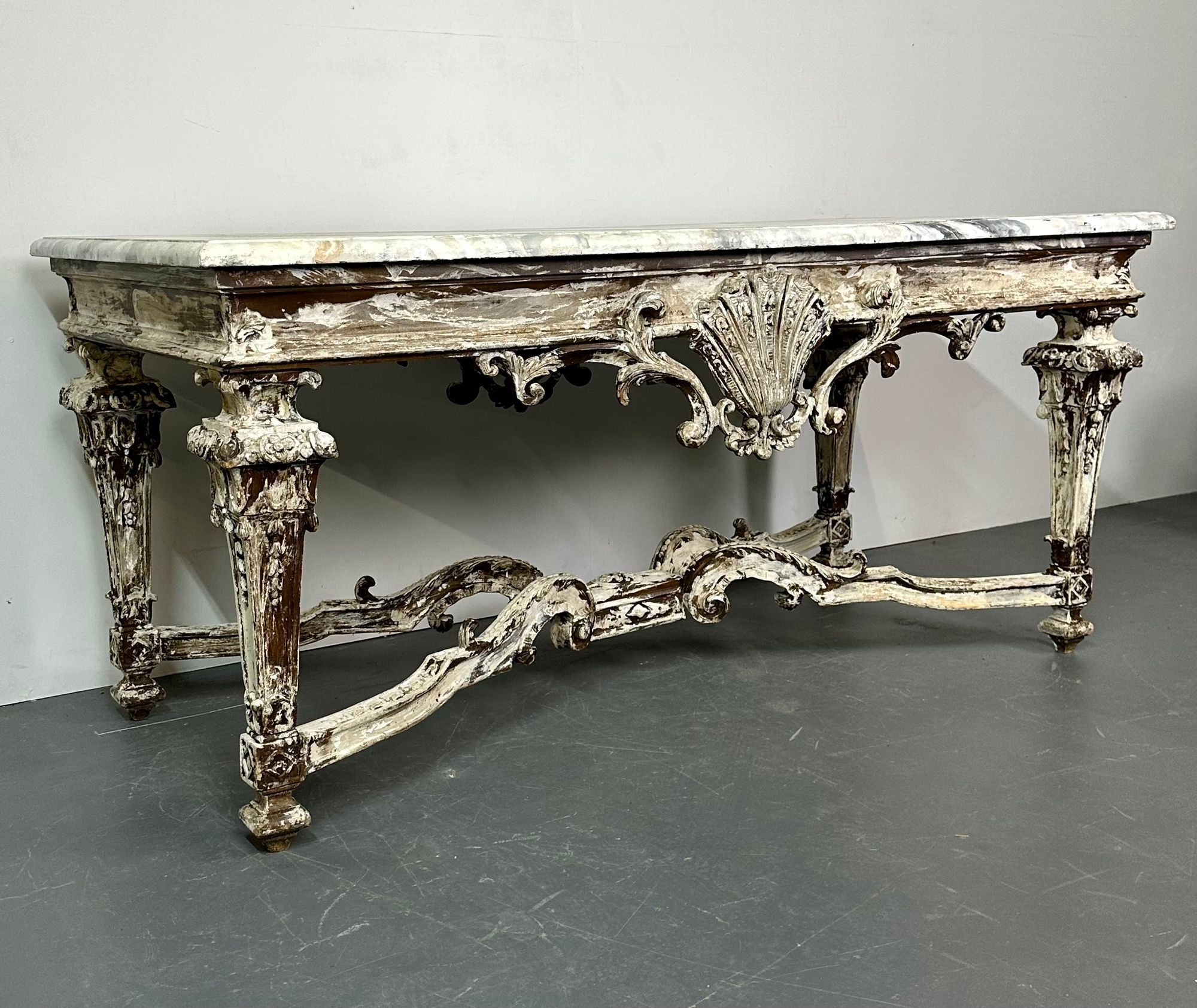 Italian Faux Marble Top Centre or Dining Table, Gustavian, Painted
A stunning painted dining or center, vestibule table in a finely painted finish having a faux white and gray veined table top supported by a shocking carved table base depicting