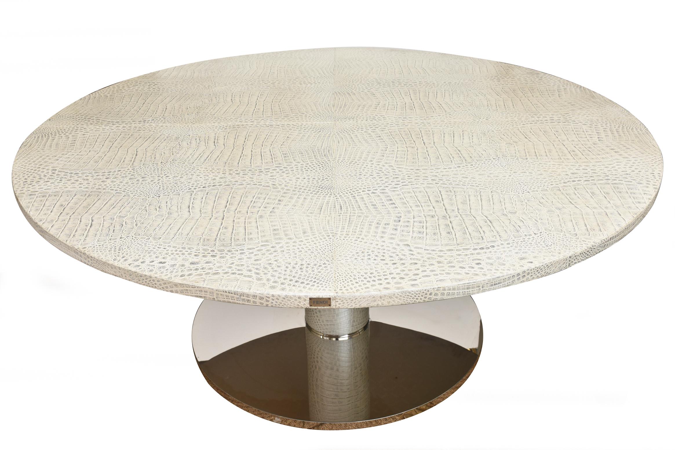 This ultra chic, exquisite and large Italian tagged monumental Fendi dining table is a beautiful combination of metallic glazed stamped printed crocodile leather and stainless steel. There is a tag that say Fendi and is shown in the photographs.