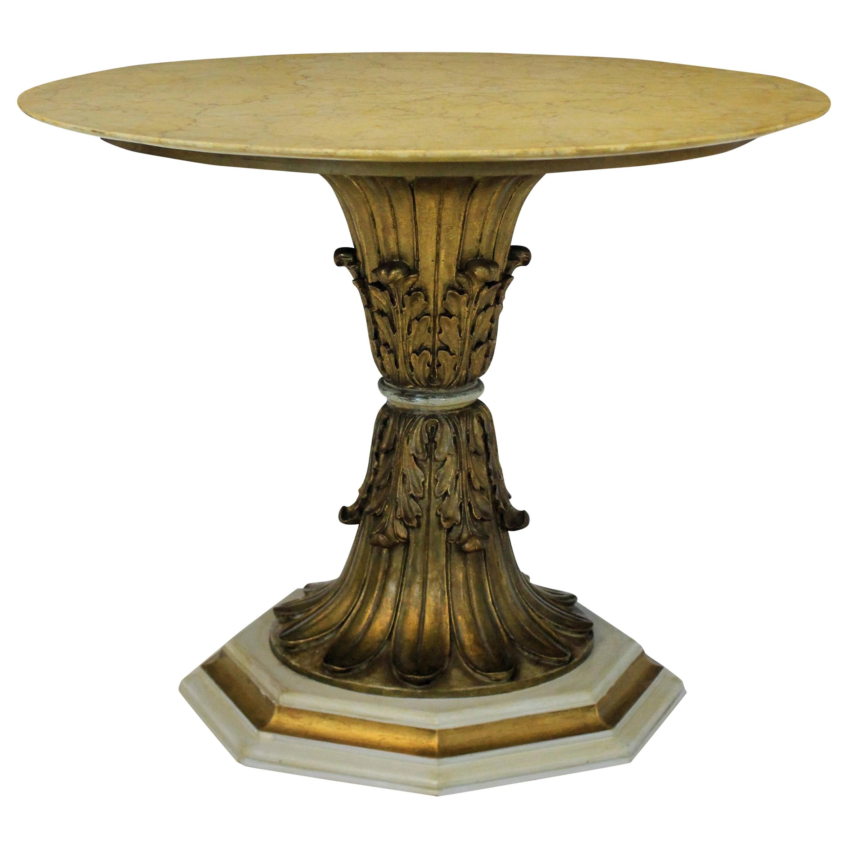 An Italian finely carved giltwood centre table depicting acanthus leaves with a circular sienna marble top.

                