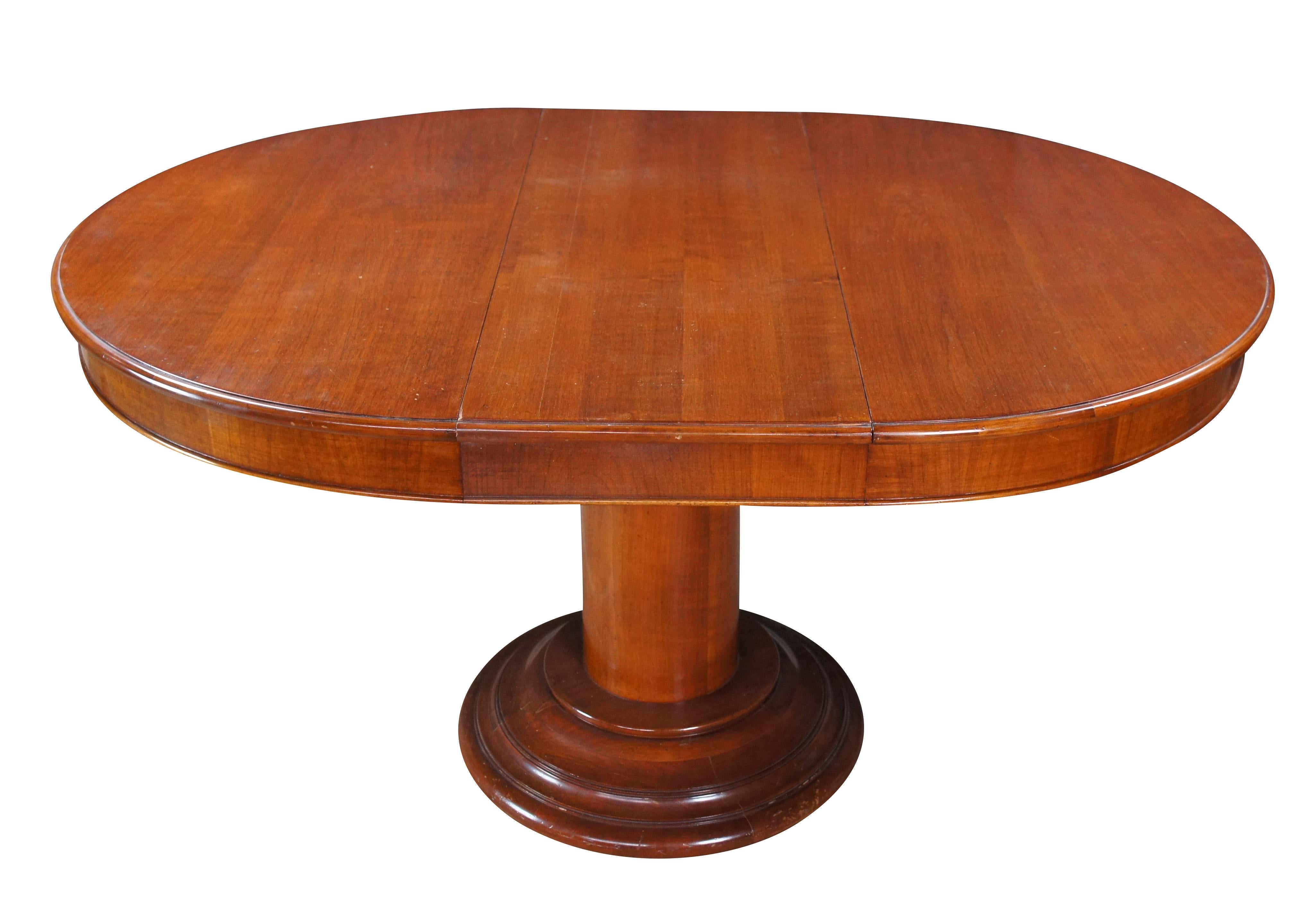 Vintage Italian Fiorini extendable breakfast / dining table.  Made of solid cherry featuring Biedermeier styling.  Includes one leaf and table pads.  Made in Italy.

Dimensions:
43