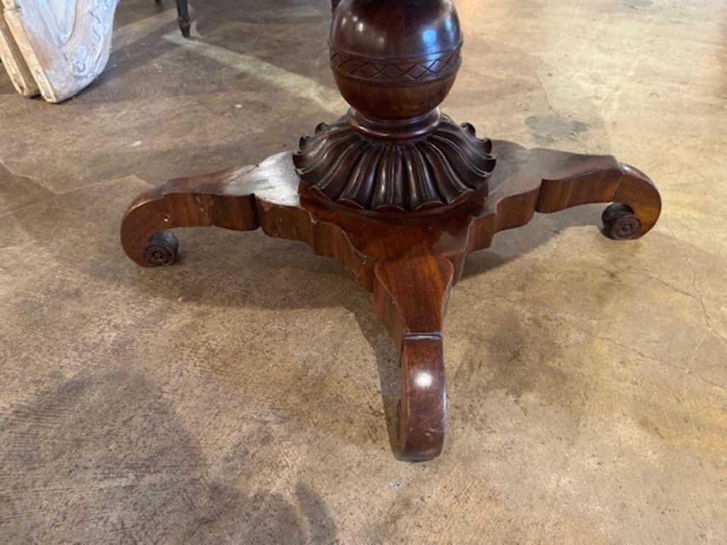 Handsome 19th century Italian flame mahogany carved  center table. Circa 1870.  Adds warmth and charm to any room! 28h x 39.5w 