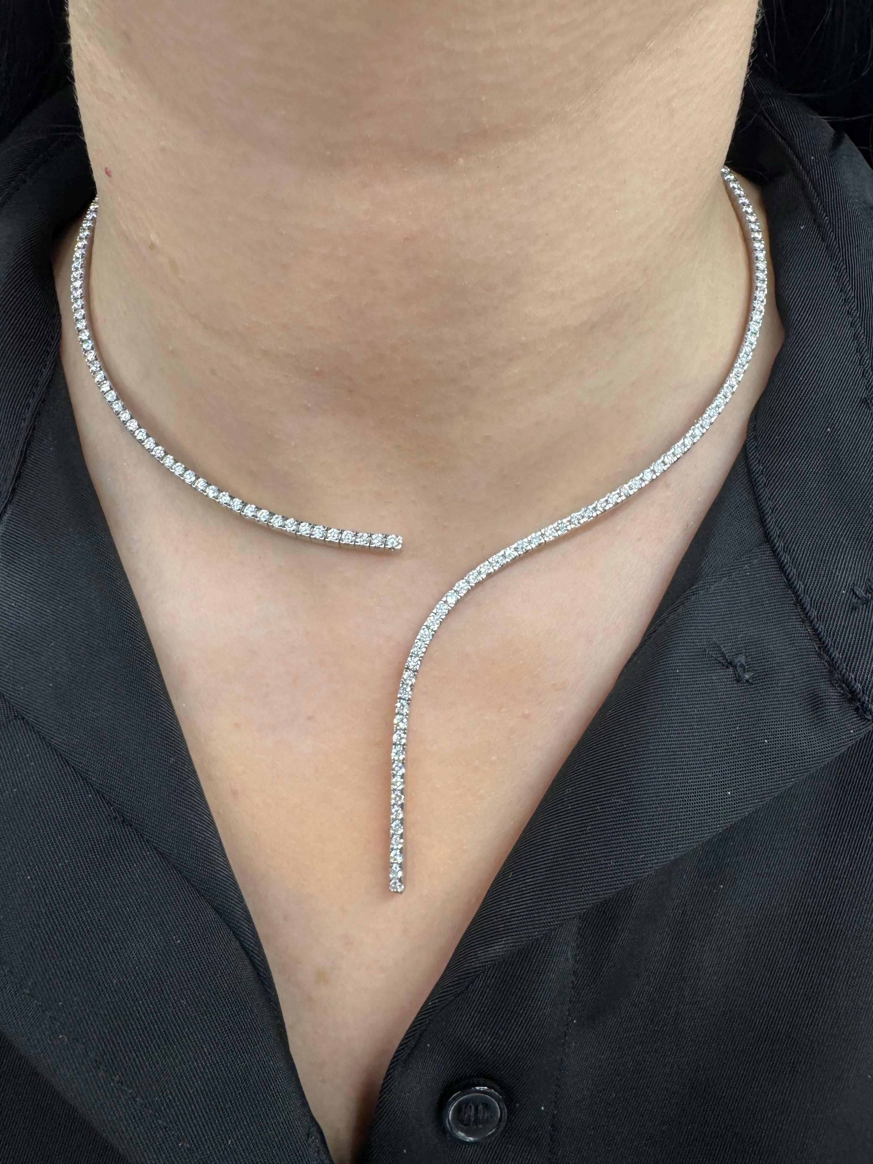 Italian, 18 karat white gold collar necklace featuring 124 round brilliants weighing 4.55 carats. Color F-G Clarity VS1-VS2

Total Show Stopper! Very Fashionable! 