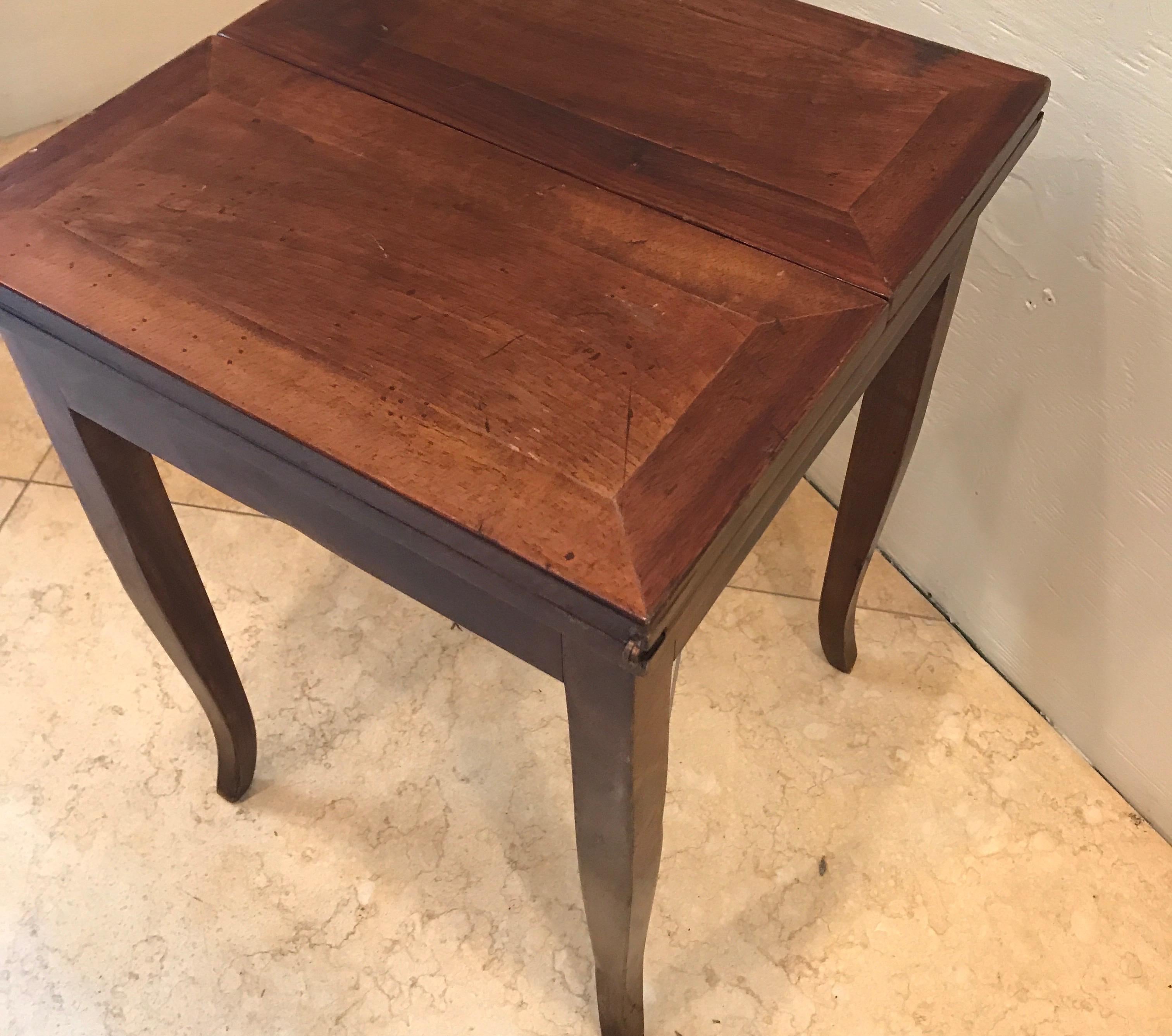 Italian walnut side table that flips open to become serving table.