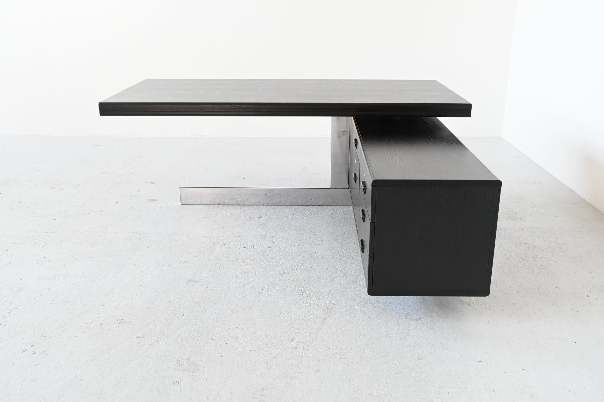 Stunning large executive desk by unknown designer or manufacturer, Italy, 1970. This very nice shaped desk has a great and innovative appearance. The top seems to float due to the strong and smart construction of the base. It is made of black