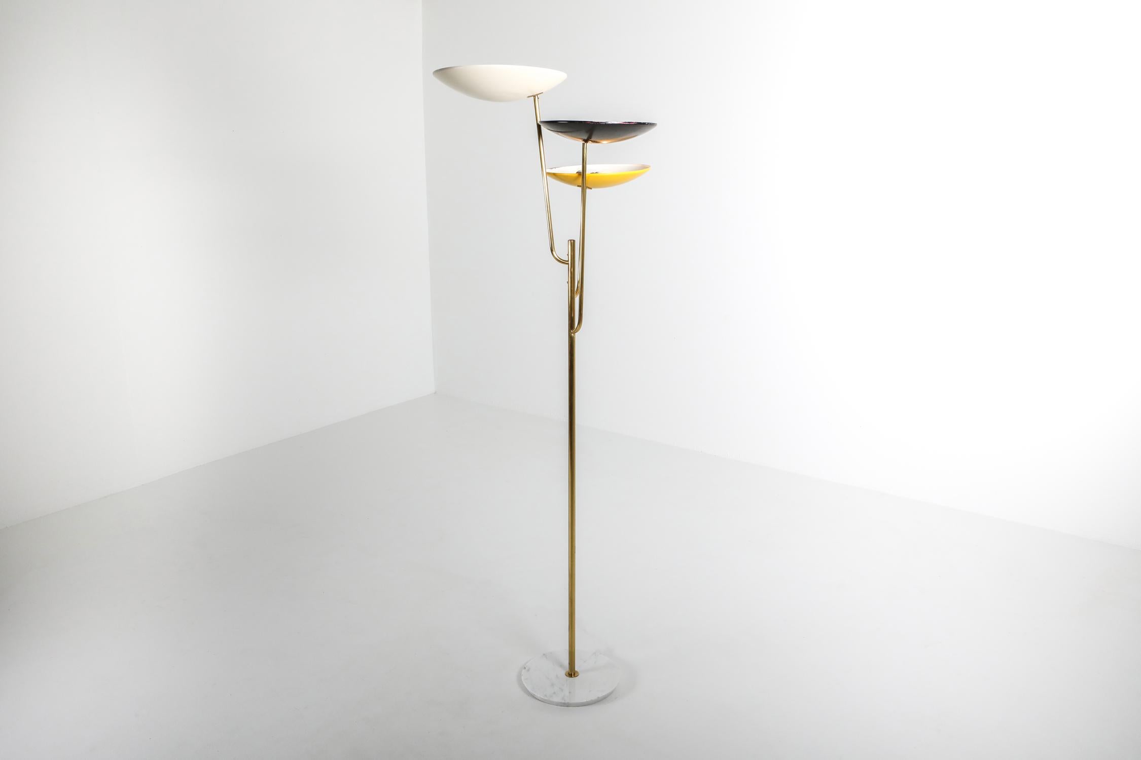 Arredoluce style uplighting floor lamp, Italy 1950s

Tricolor floor lamp, brass stem and white, yellow and black lacquered metal shade.
 