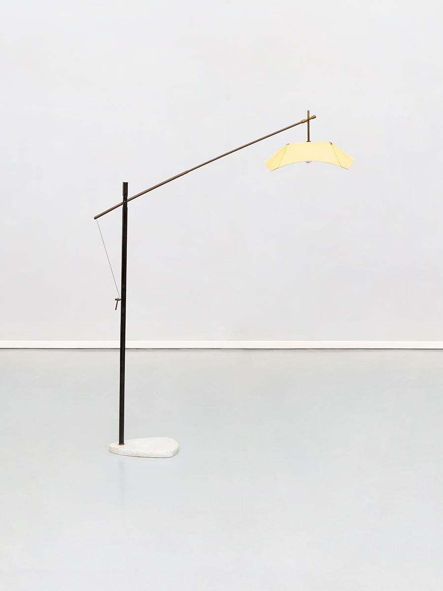 Italian floor lamp by Angelo Lelii for Arredoluce, from 1950s
Astonishing and extremely rare piece designed by Angelo Lelii in the 1950s. A black metal rod, finely brass detailed, is placed on a marble Stand with round angles, and a brass switch on