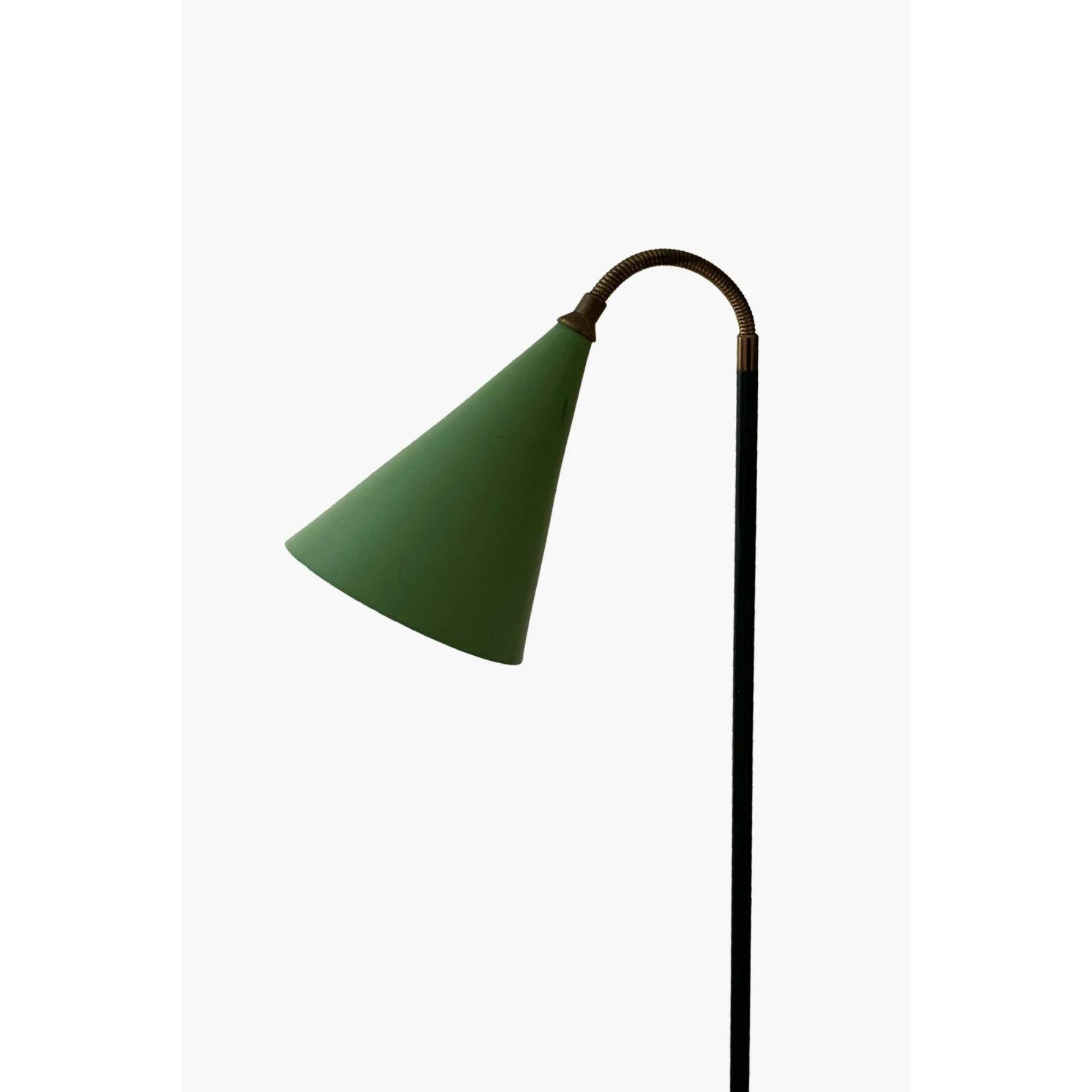 Italian floor lamp by Angelo Ostuni, 1950s.

Adjustable floor lamp by Angelo Ostuni for O-Luce. With green lacquered aluminium conical shade. Mounted on a marble base. Italian, 1950s. Wired with EC fittings.

Dimensions: H 170cm.