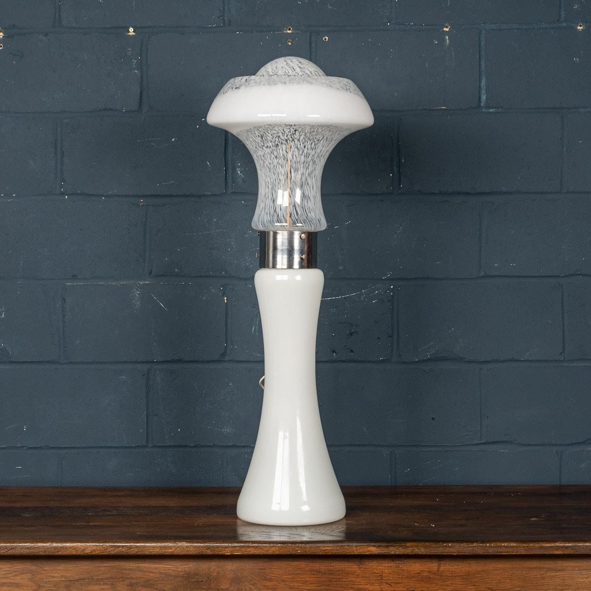 A wonderful vintage Italian floor lamp or large table lamp made by Carlo Nason for Mazzega. Produced in Murano, Venice in the 1980s, this chrome and glass lamp exemplifies Carlo Nason’s workmanship. Nason has used a lovely shaped white form for the