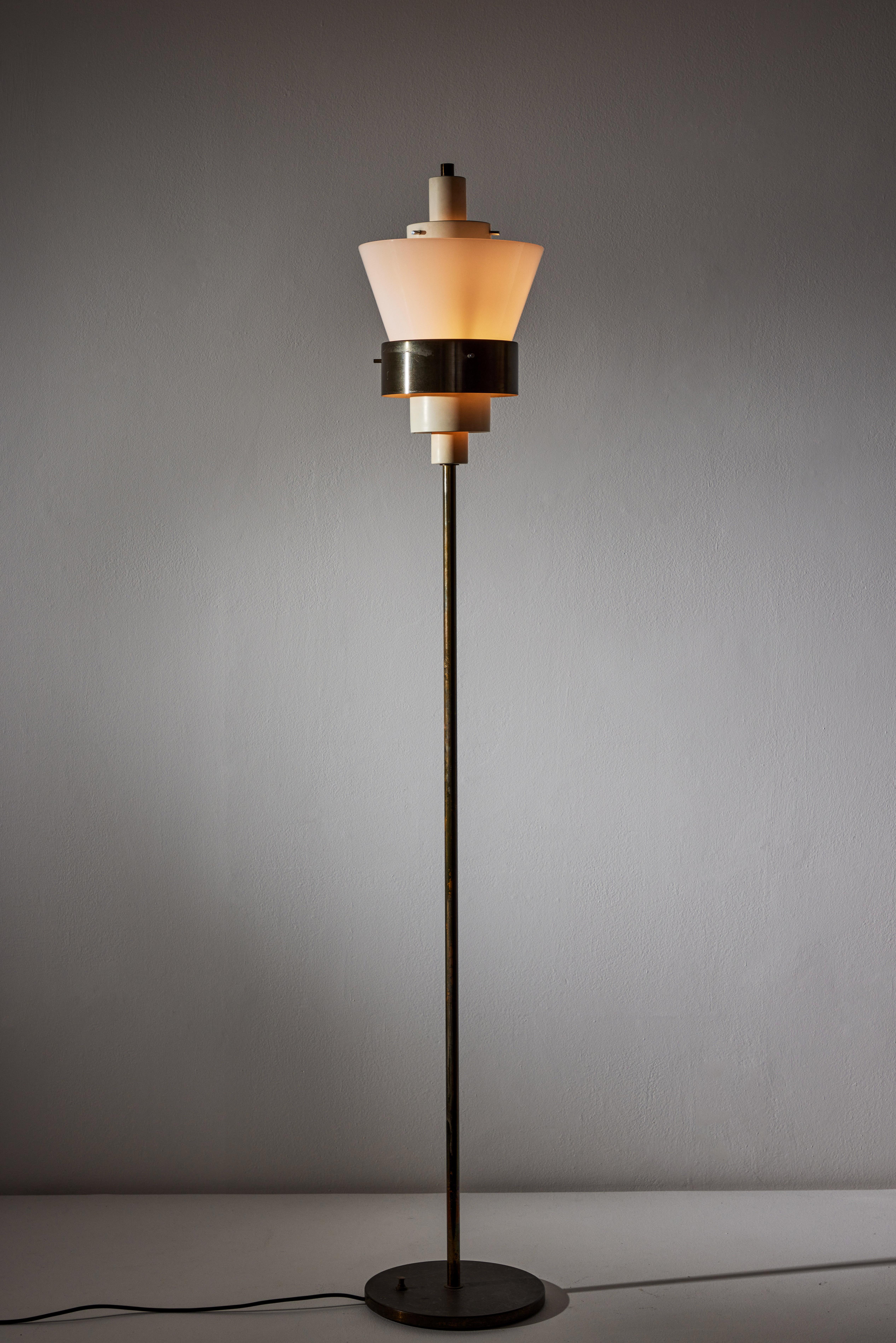 Floor Lamp manufactured in Italy, circa 1960s. Brass, opaline glass, original cord that requires U.S. adaptor. We recommend one E26 75w maximum bulb. Bulb provided as a one time courtesy.