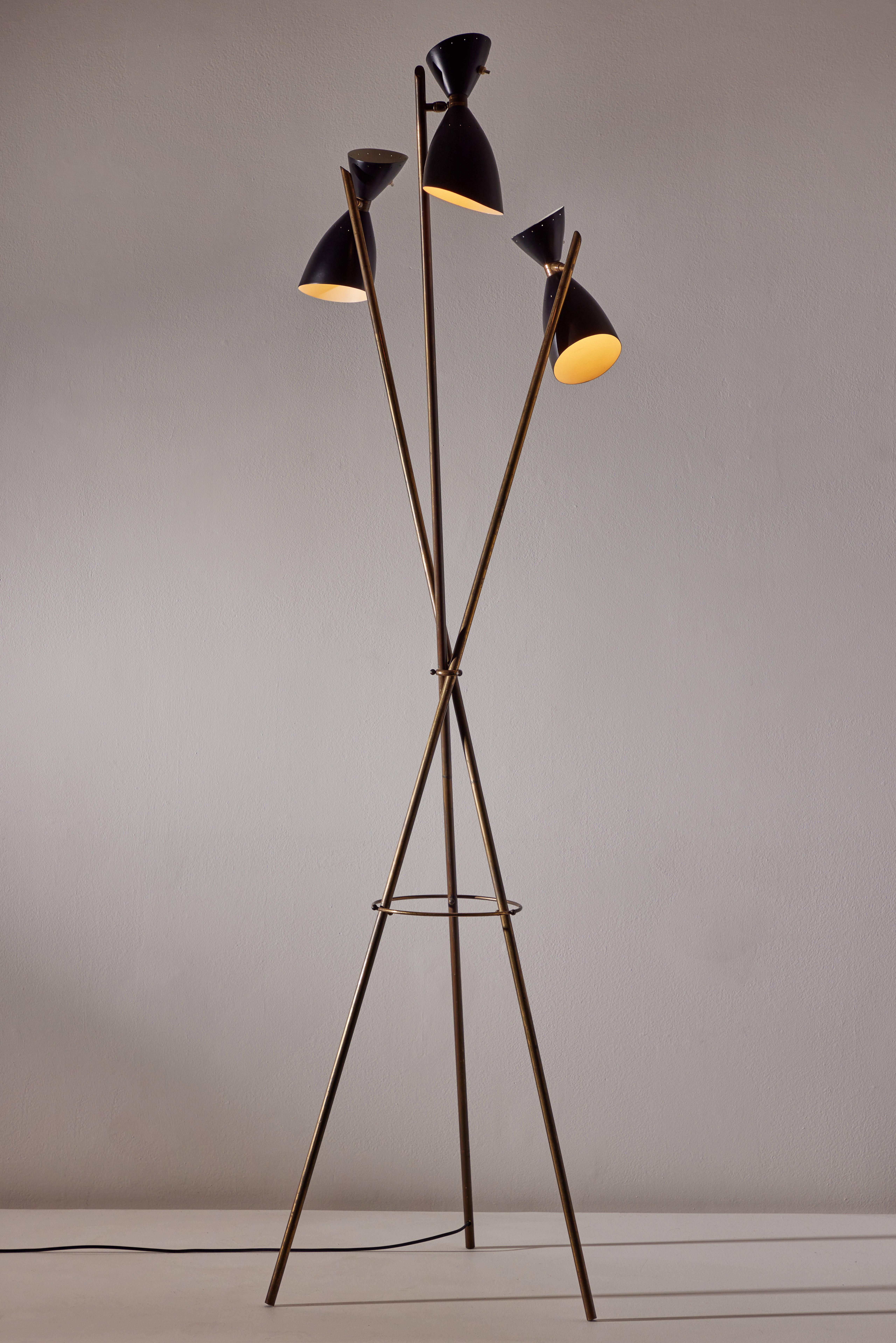 Floor lamp designed and manufactured in Italy, circa 1950's. Enameled metal shades, brass frame. Original cord. Shades articulate to various positions. We recommend three E27 60w maximum bulbs. Bulbs provided as a one time courtesy.