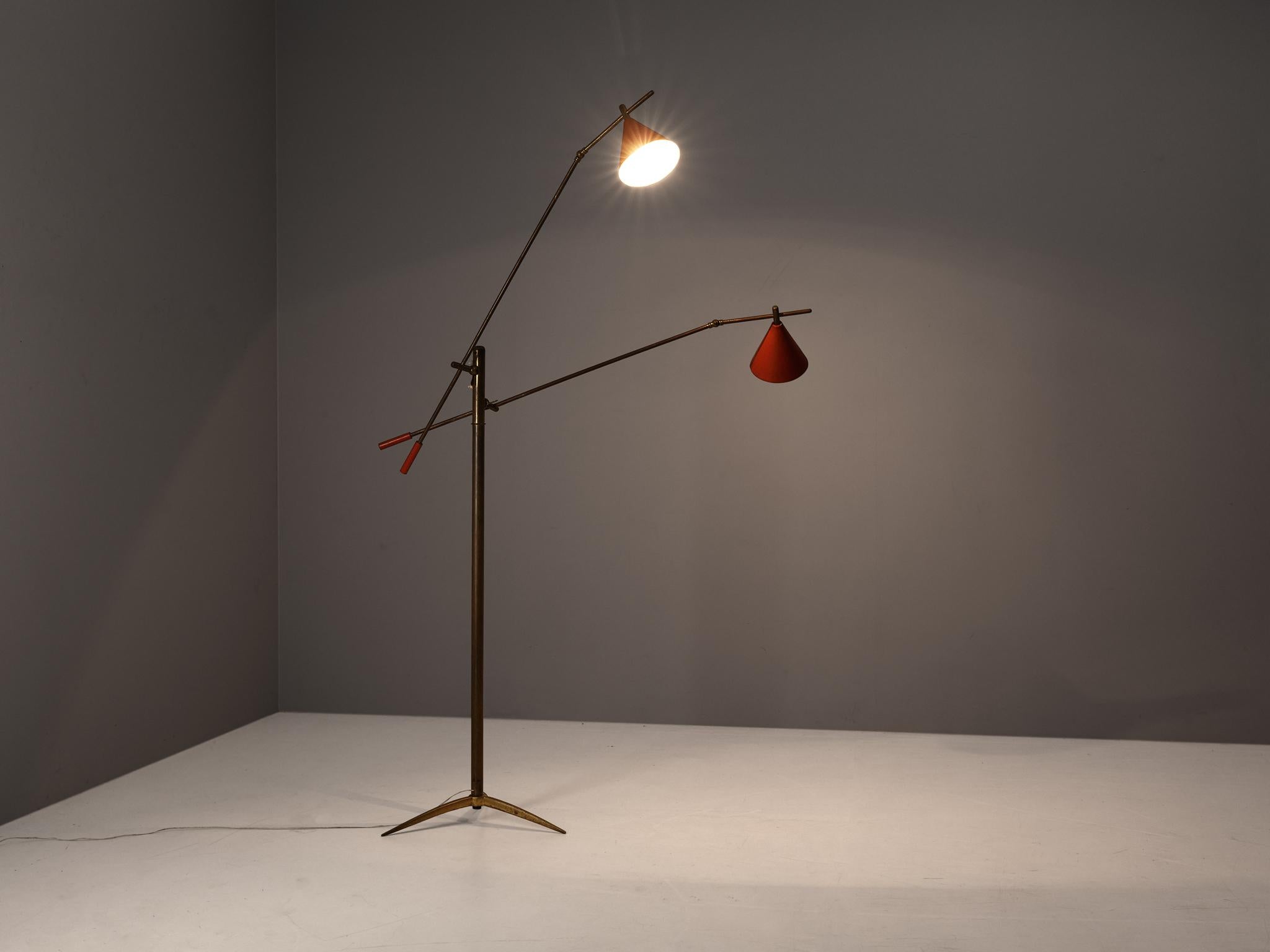 Floor lamp, brass, coated aluminum, Italy, 1950s

A radiant floor lamp in brass and metal, manufactured and designed in Italy in the 1950s. The lamp has two elegant red coated shades on smaller rods, adjustable as desired. The base of this lamp is a