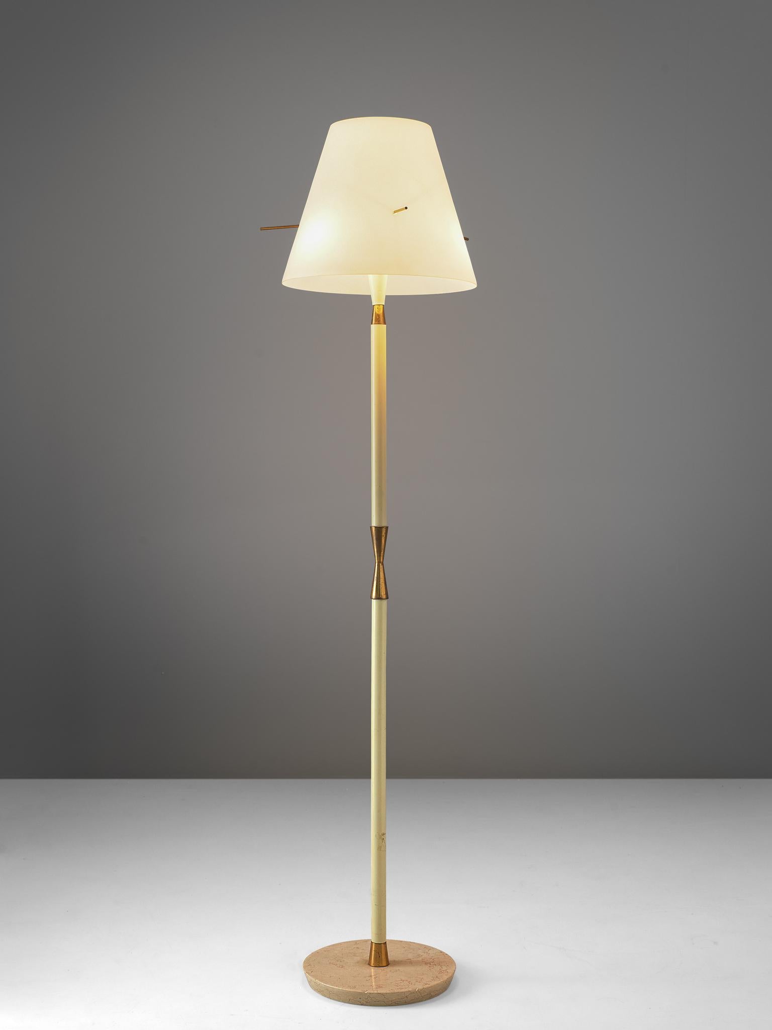 Floor lamp, metal, granite and brass, Italy, 1960s.

Elegant floor lamp with granite foot. Consisting of an off-white lacquered metal base, finished with brass hour-glass details. The base holds up a large shade with brass pins. The