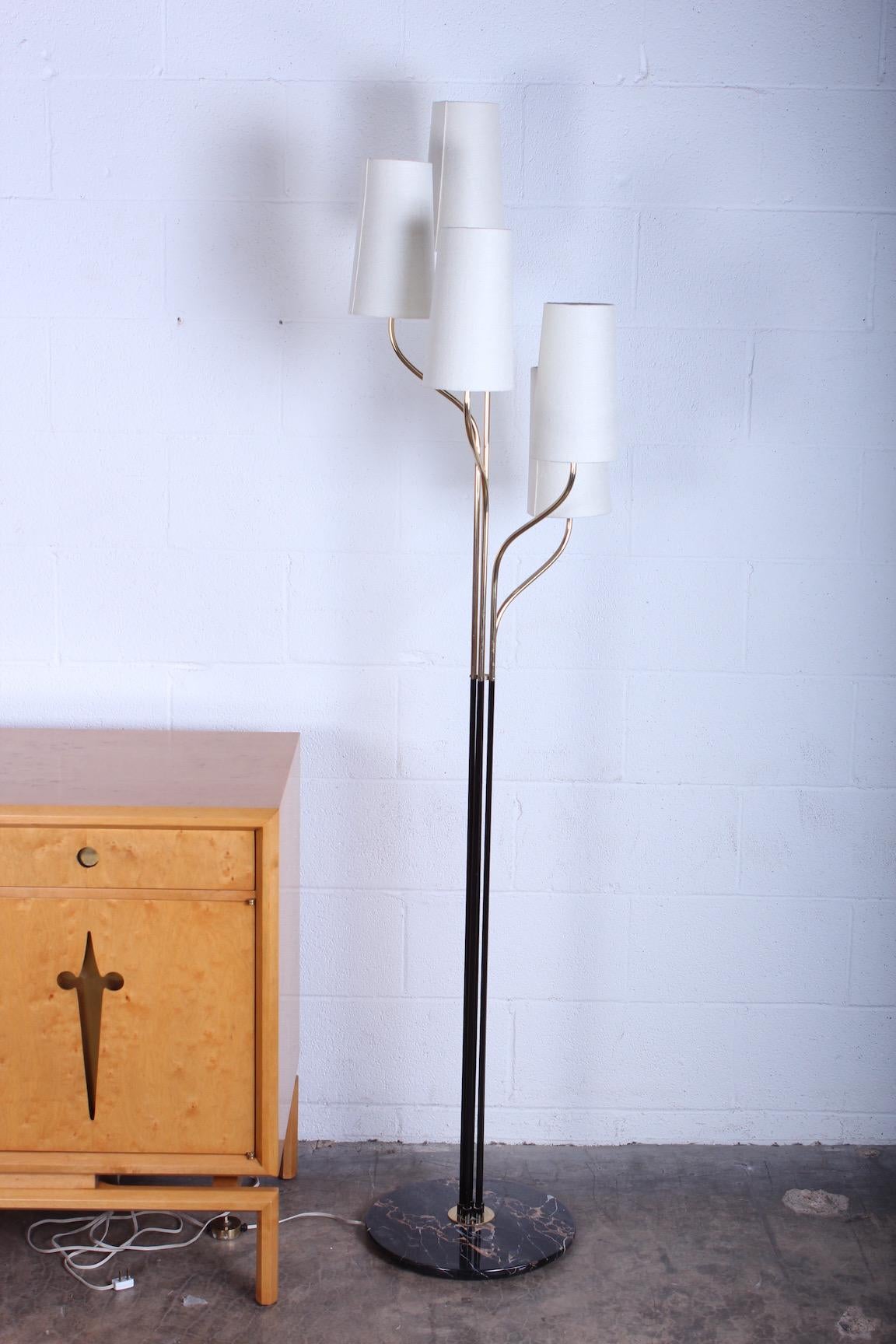 A well crafted Italian brass floor lamp on marble base.