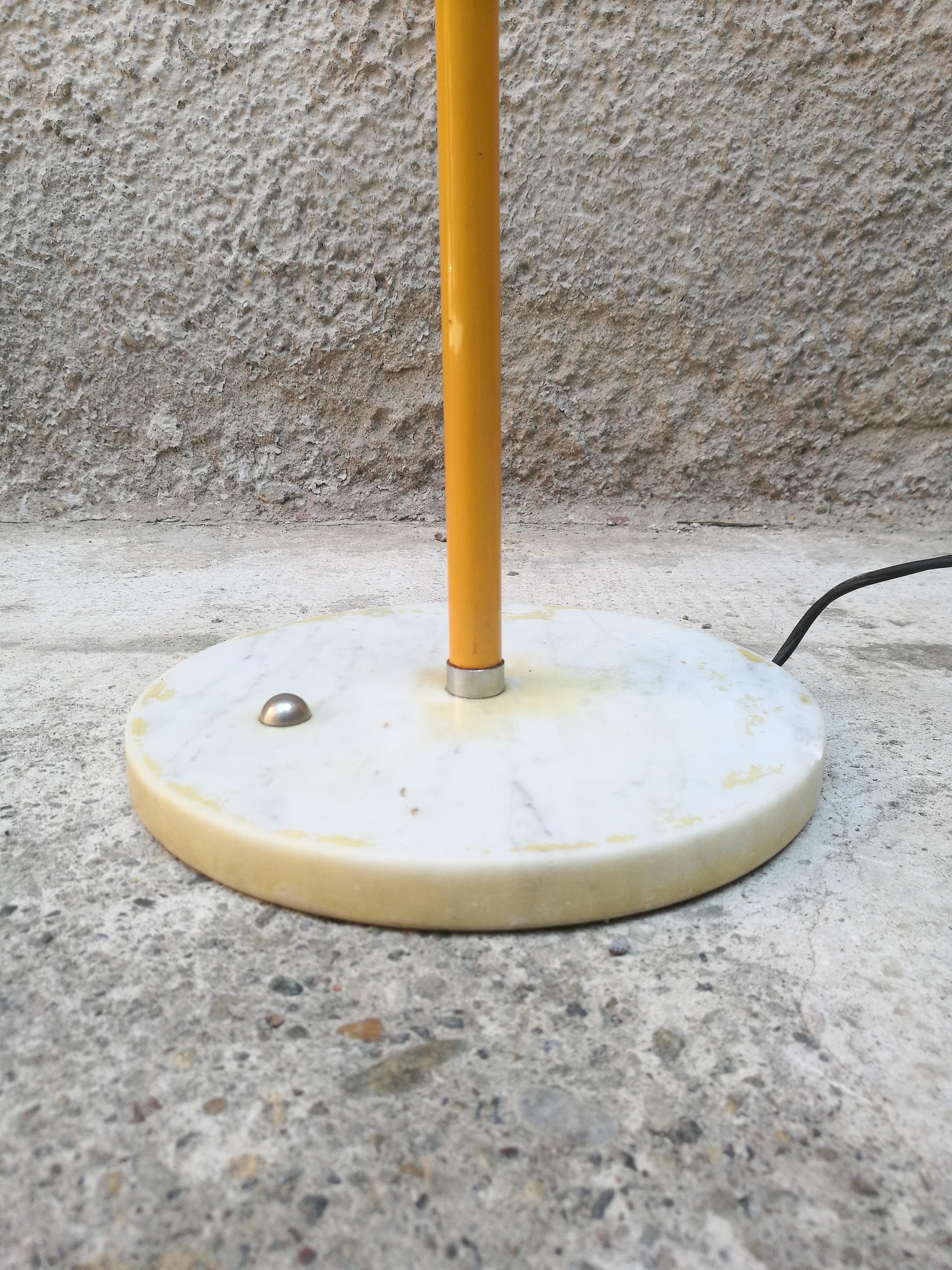 Italian floor lamp with circle yellow lampshade and marble base, Reggiani, 1970
The lamp have one switch in each bulb to governate the light, the marble base is in white Carrara marble.
 
