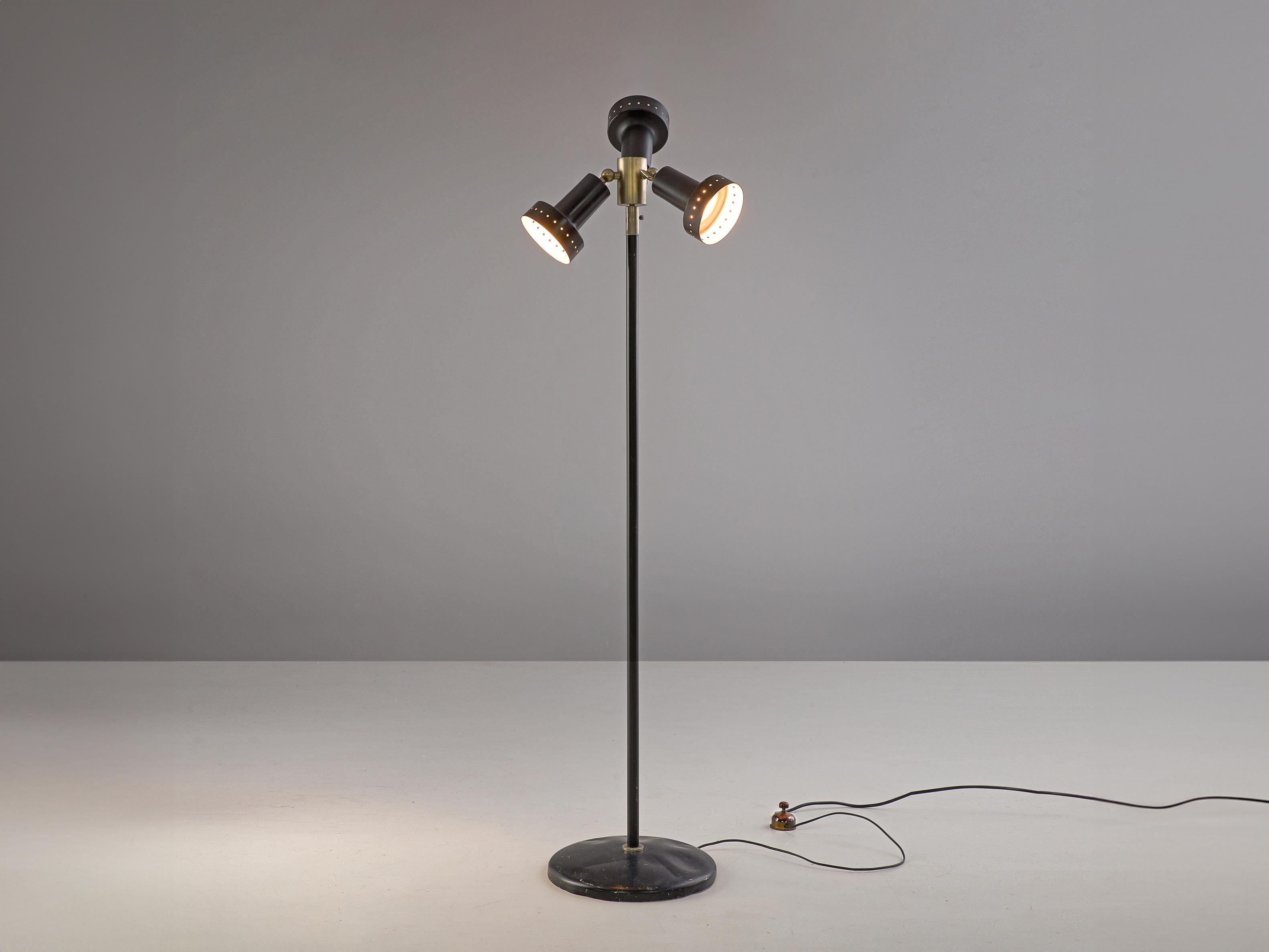 Floor lamp, nickel-plated brass, coated metal, Italy, 1960s

This elegant floor lamp originates from Italy and is a striking blend of grace and industrial style. The design features three black coated shades that can be adjusted in their angle. The