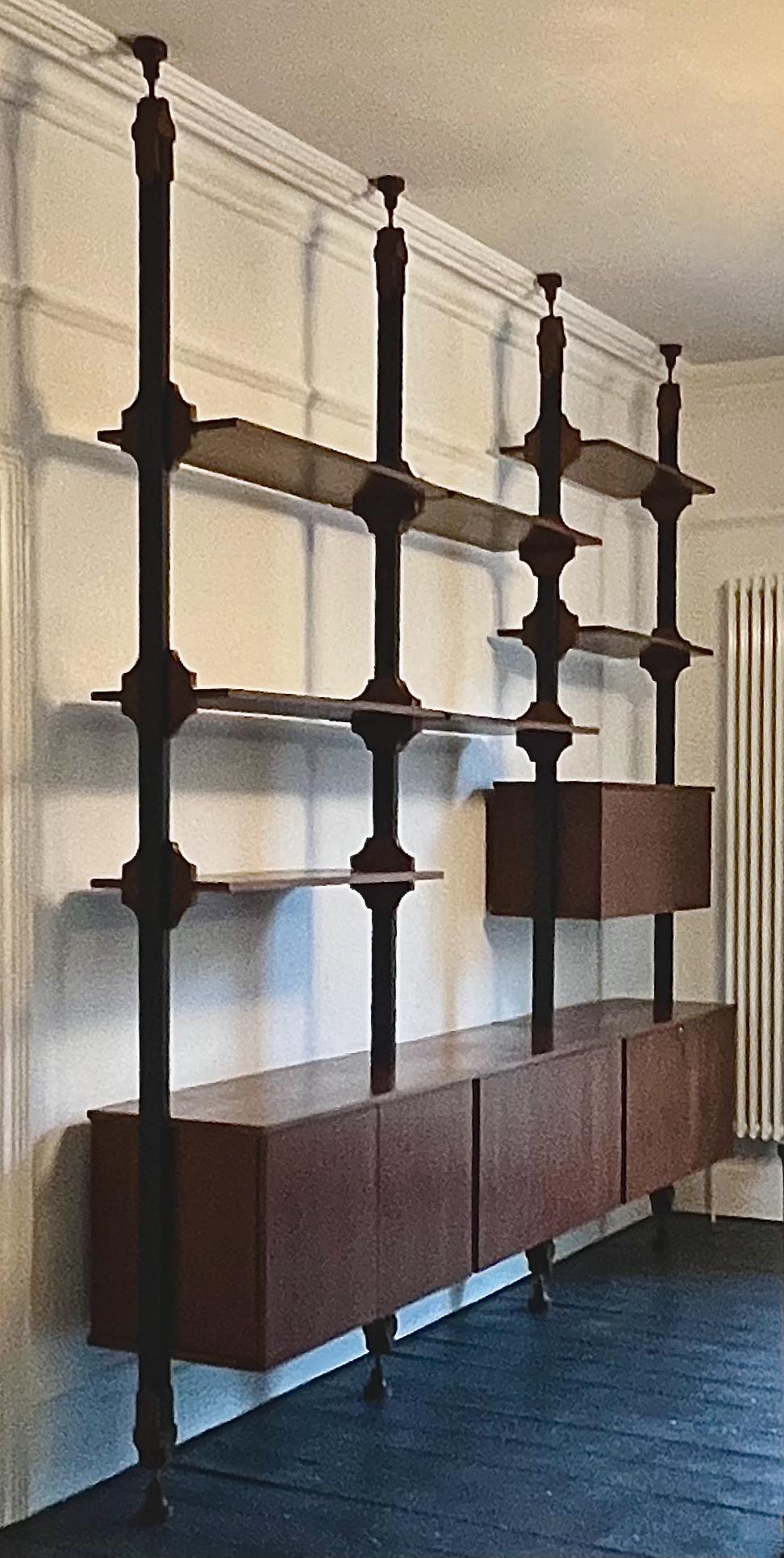 A floor-to-ceiling shelving unit, with space for both display and storage. Italy, second half 20th century. Designer unknown.

The shelving unit is made up of separate components - uprights, cupboards and shelves - which could be used as a single