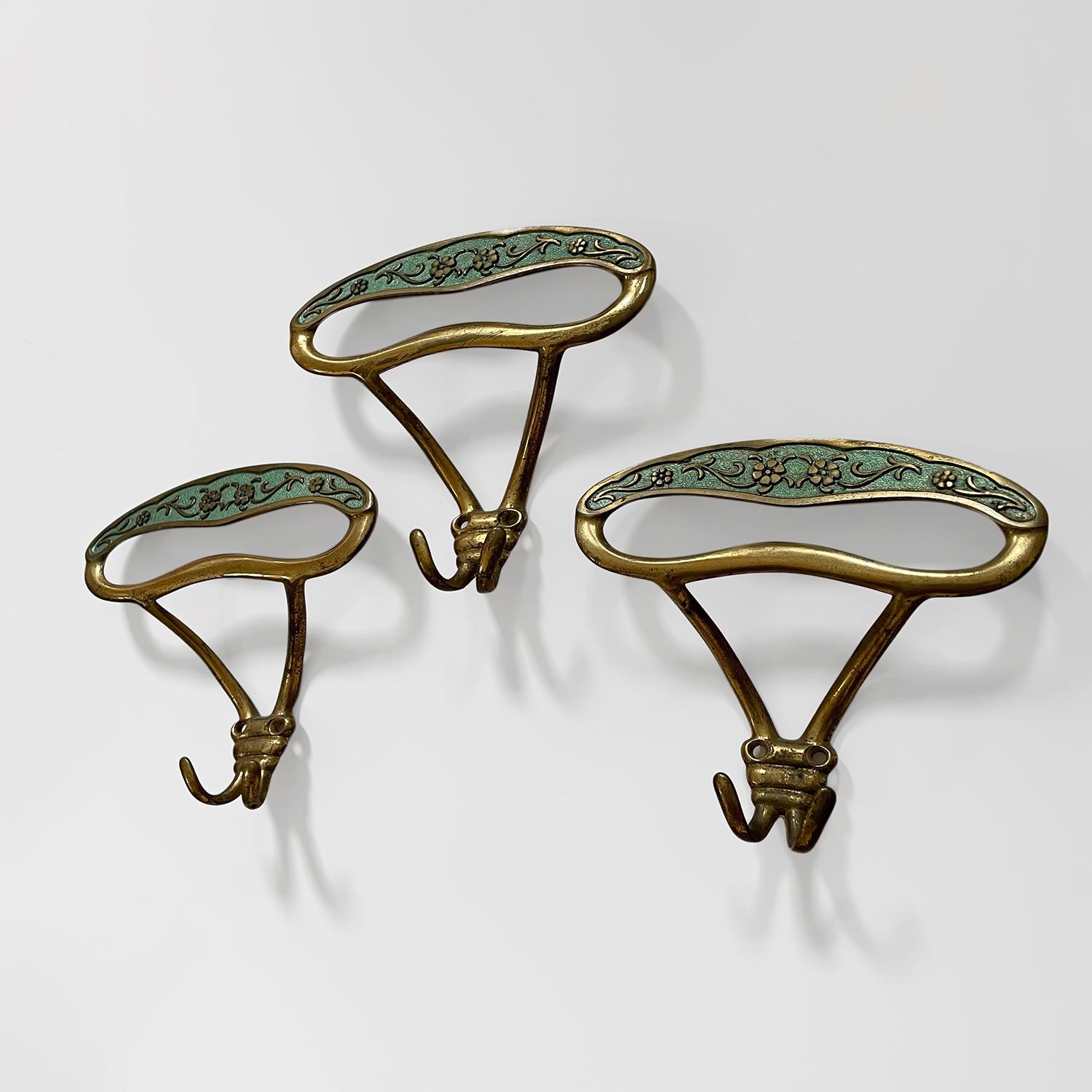 Italian floral wall hooks
Italy, circa 1950’s
Each hook provides plenty of storage with an upper arched wide panel hook and a double lower split hook
Embossed floral detailing is beautifully contrasted with a rich vibrant green backdrop
Each wall