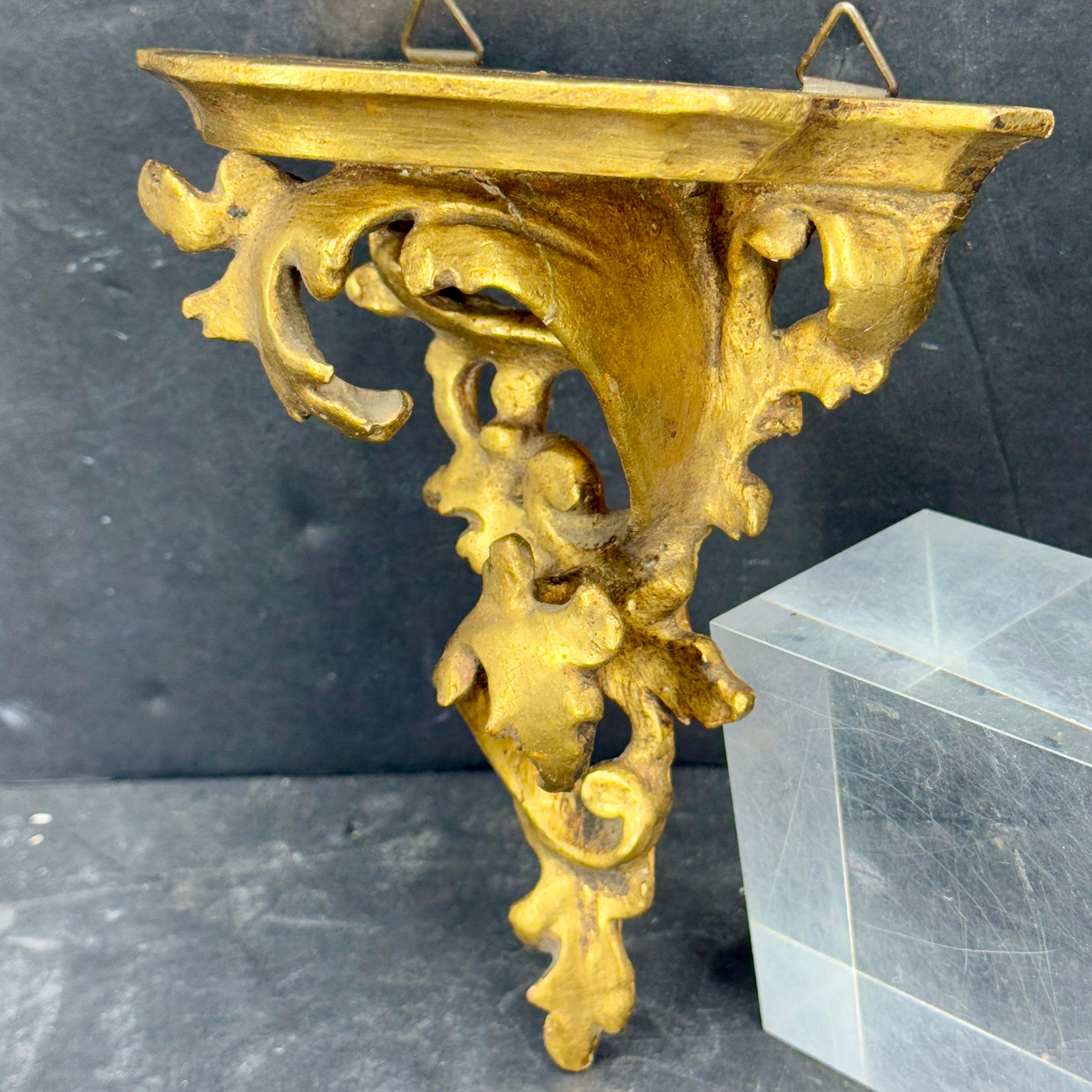 Gorgeous Italian Small Gold Leaf Wall Shelf. This bracket could certainly stand alone on a narrow wall or functional to hold a treasure on top. Wonderful classic addition to any living room, dining room or bedroom setting.  Made in Italy, with