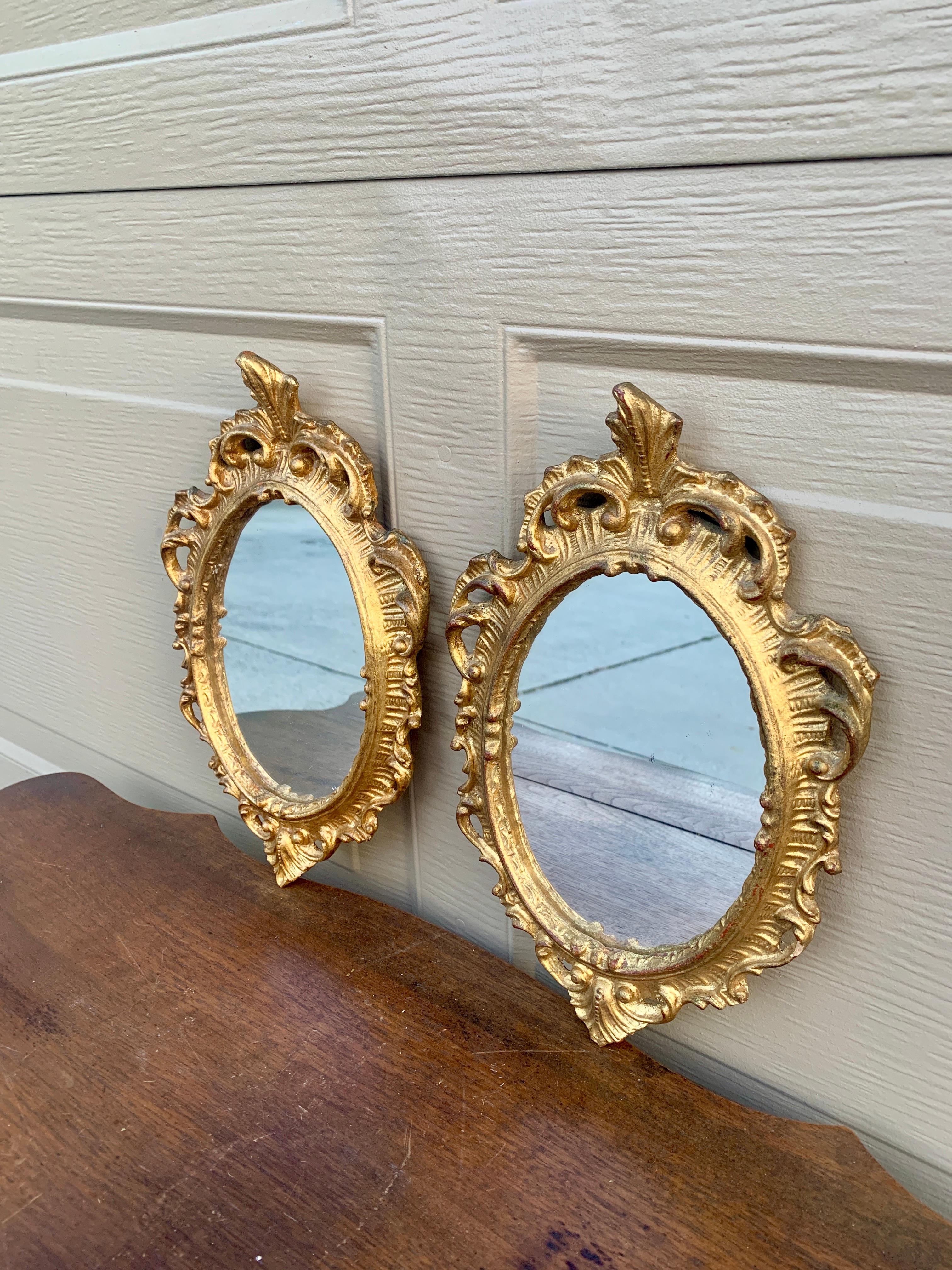 A stunning pair of Italian Florentine baroque rococo style wall mirrors

Italy, Circa 1960s

Gold gilt wood, with mirror.

Measures: 7.25