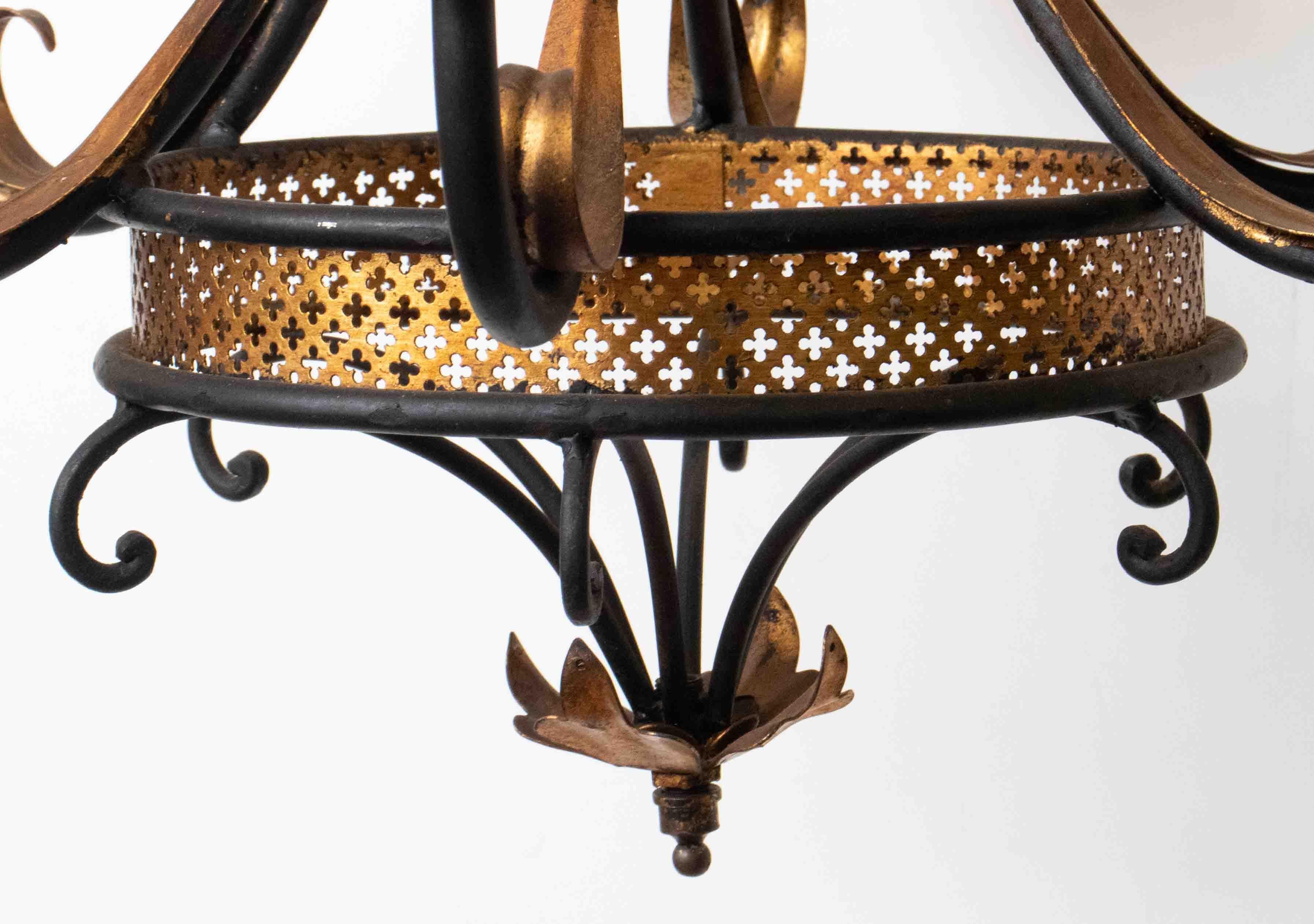 1950's Italian Florentine black and gold metal chandelier with six (60 lights. Made in Italy in the 1950's. Recently rewired for the US. Chandelier comes with extra chain and a canopy.