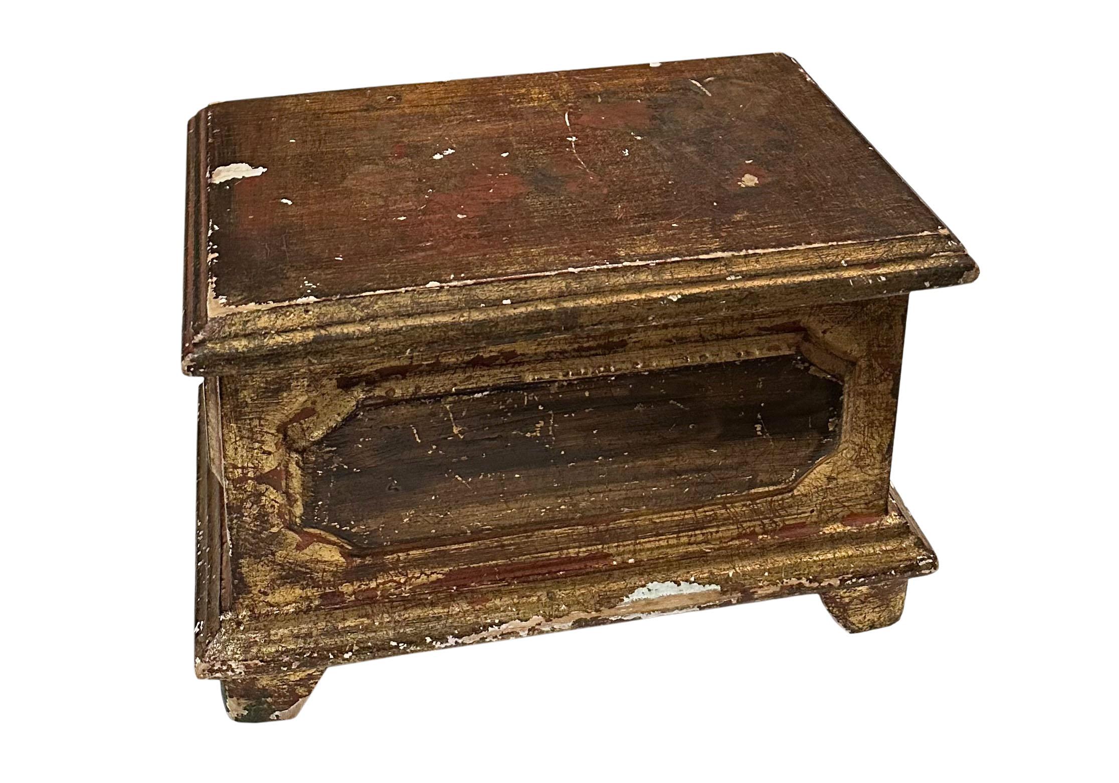 A turn-of-the-century gold gilt wood Florentine box from Italy. The interior is a pinky red or an Italian red has a great surface which is pretty typical of this kind of box and age.